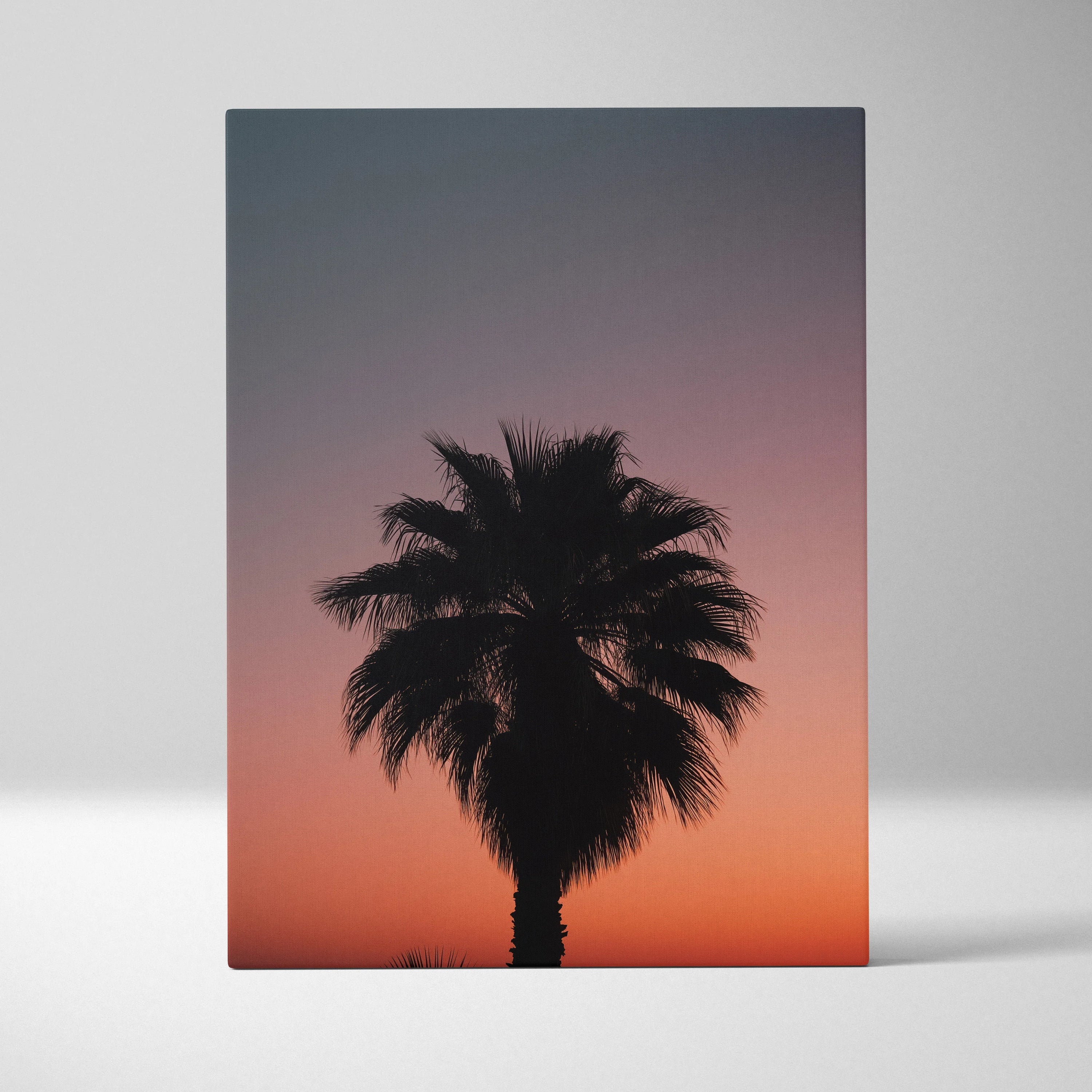 Vertical canvas wall art featuring a tropical palm tree silhouette against a vibrant dusk sky decor.