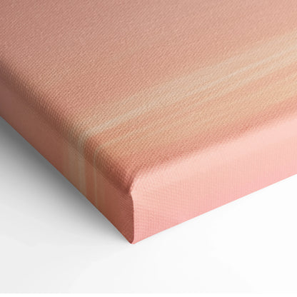 Close-up of stretched canvas corner with soft pink and peach gradient on textured fabric wall art.