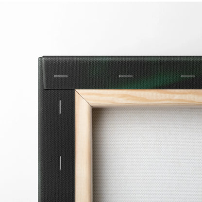 Close-up of black-stretched canvas frame with natural wood stretcher bars and white canvas surface.
