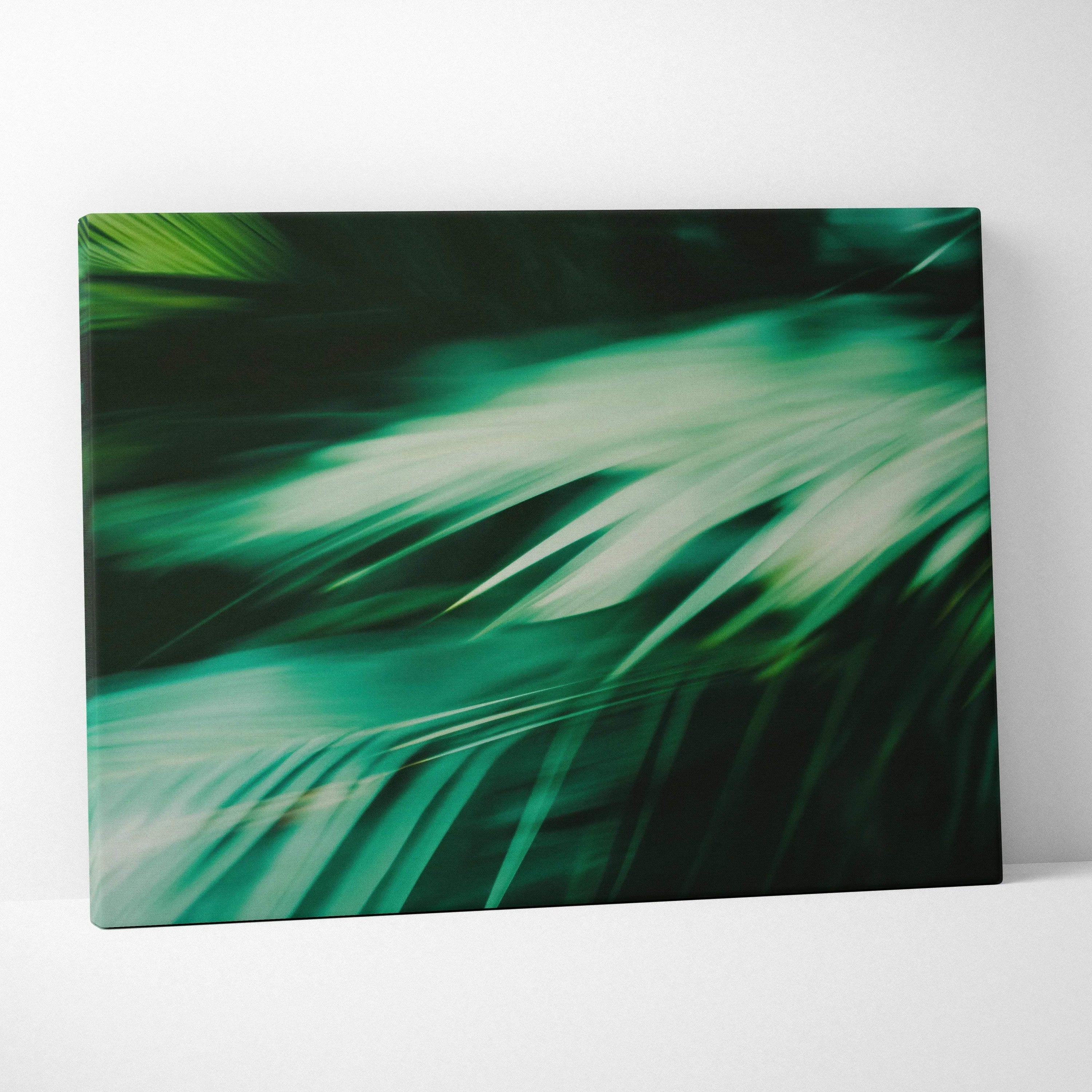 Green tropical leaves close-up digital art on canvas wall decor with dark background.
