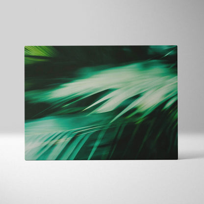 Abstract close-up of green tropical leaves on canvas wall art with motion blur effect decor.