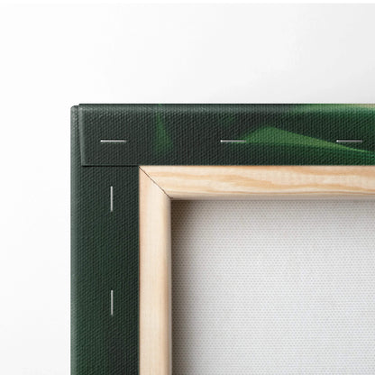 Close-up of wooden frame corner and stapled green canvas edge with subtle palm leaf print on wall art decor.