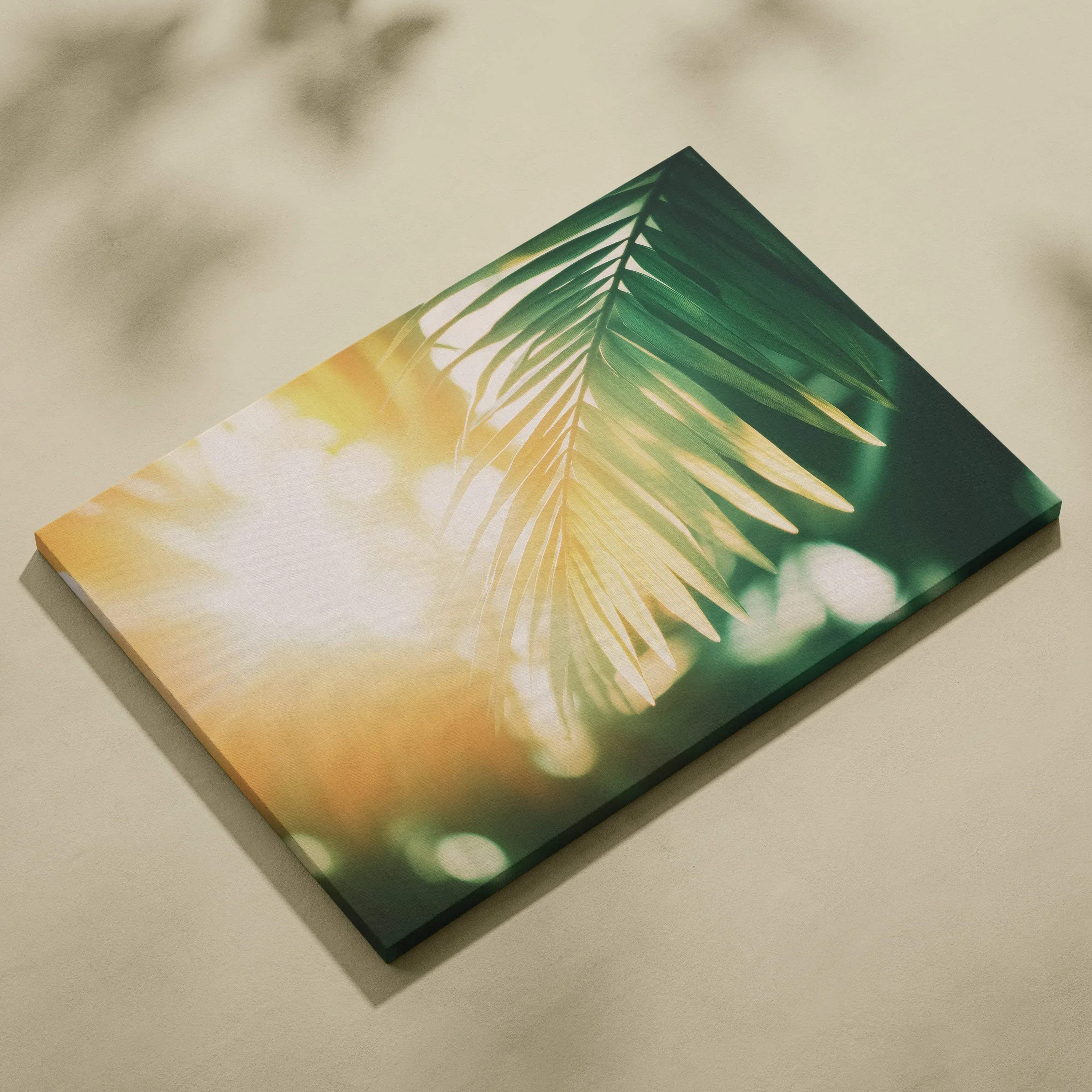 Canvas wall art featuring digital tropical palm leaves bathed in warm golden sunlight and soft green tones.