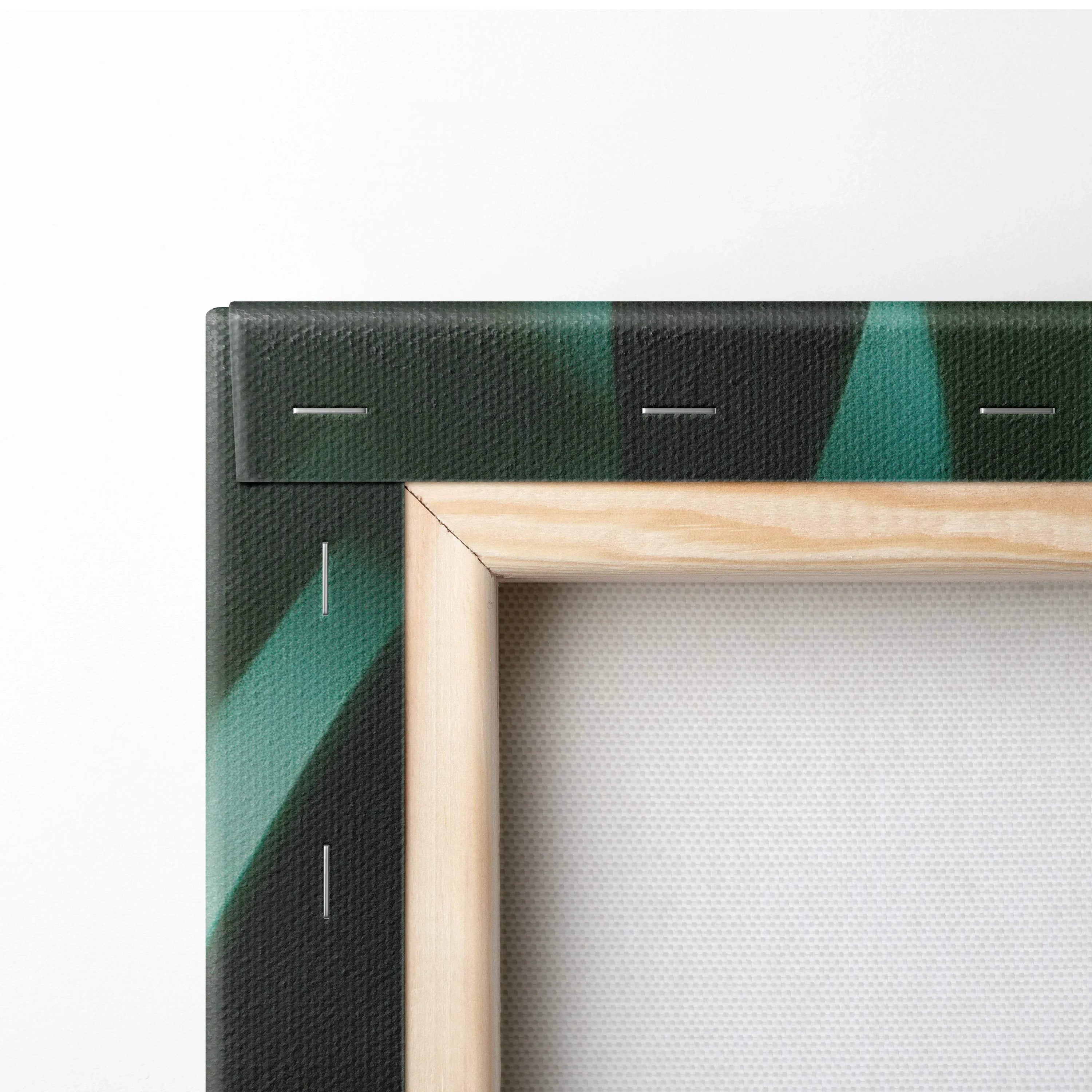 Corner of stretched canvas wall art showing wooden frame and dark green tropical leaf design with golden sun flare accents.