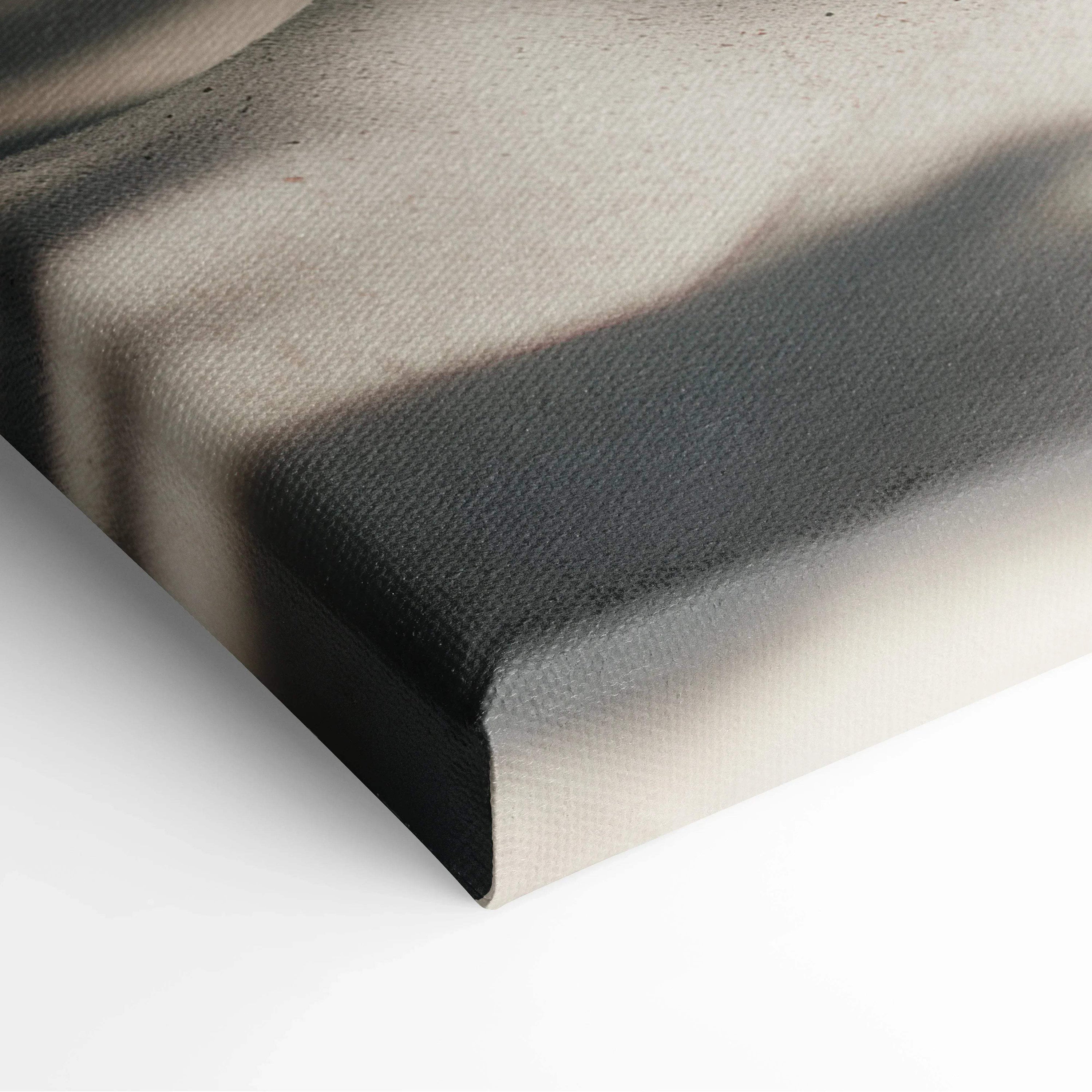 Close-up of canvas texture and wrapped corner on tropical beach wall art with soft sand and shadow details.