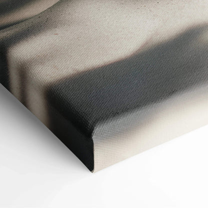 Close-up of canvas texture and wrapped corner on tropical beach wall art with soft sand and shadow details.