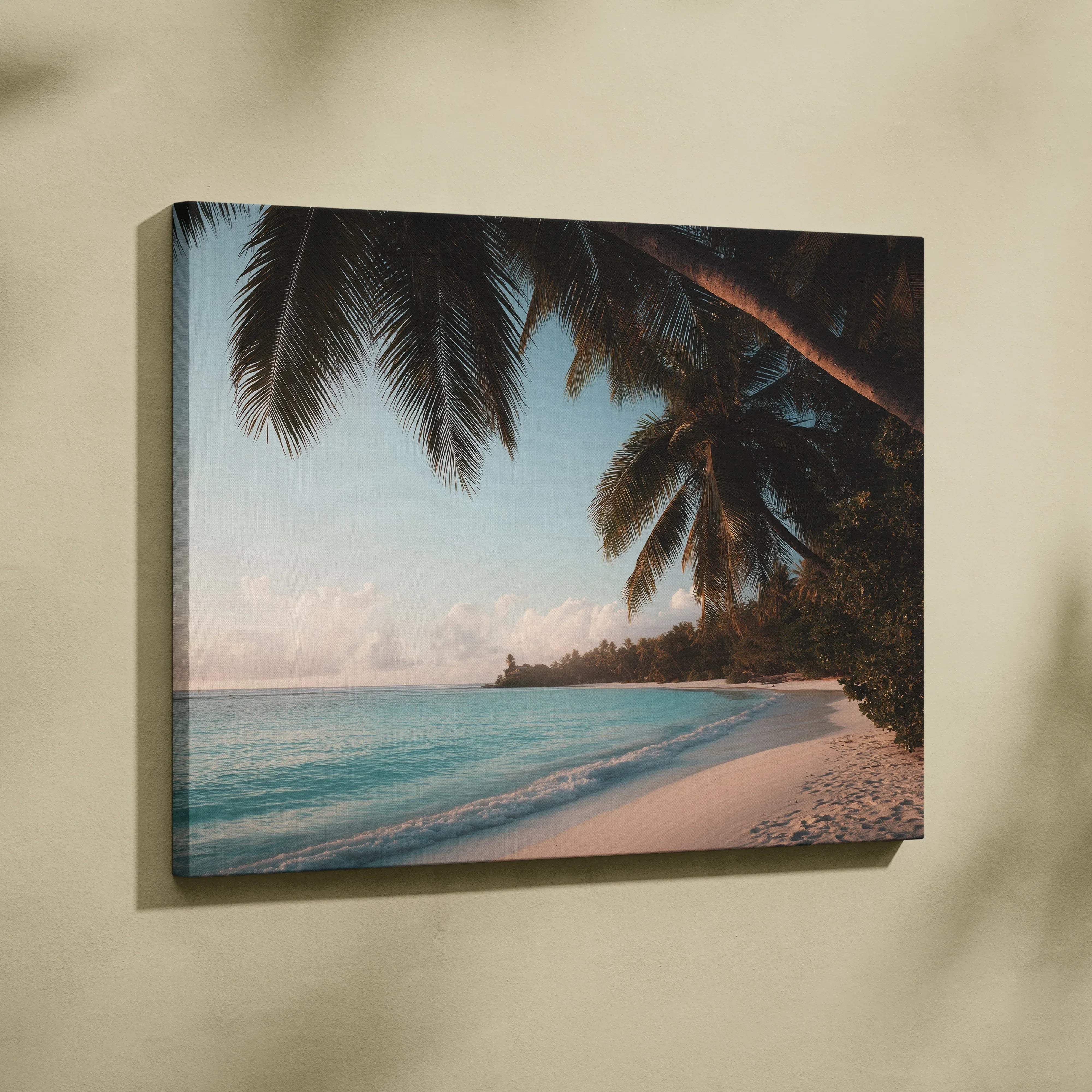 Beige wall-mounted canvas print of tropical beach scene with turquoise water white sand and palm fronds