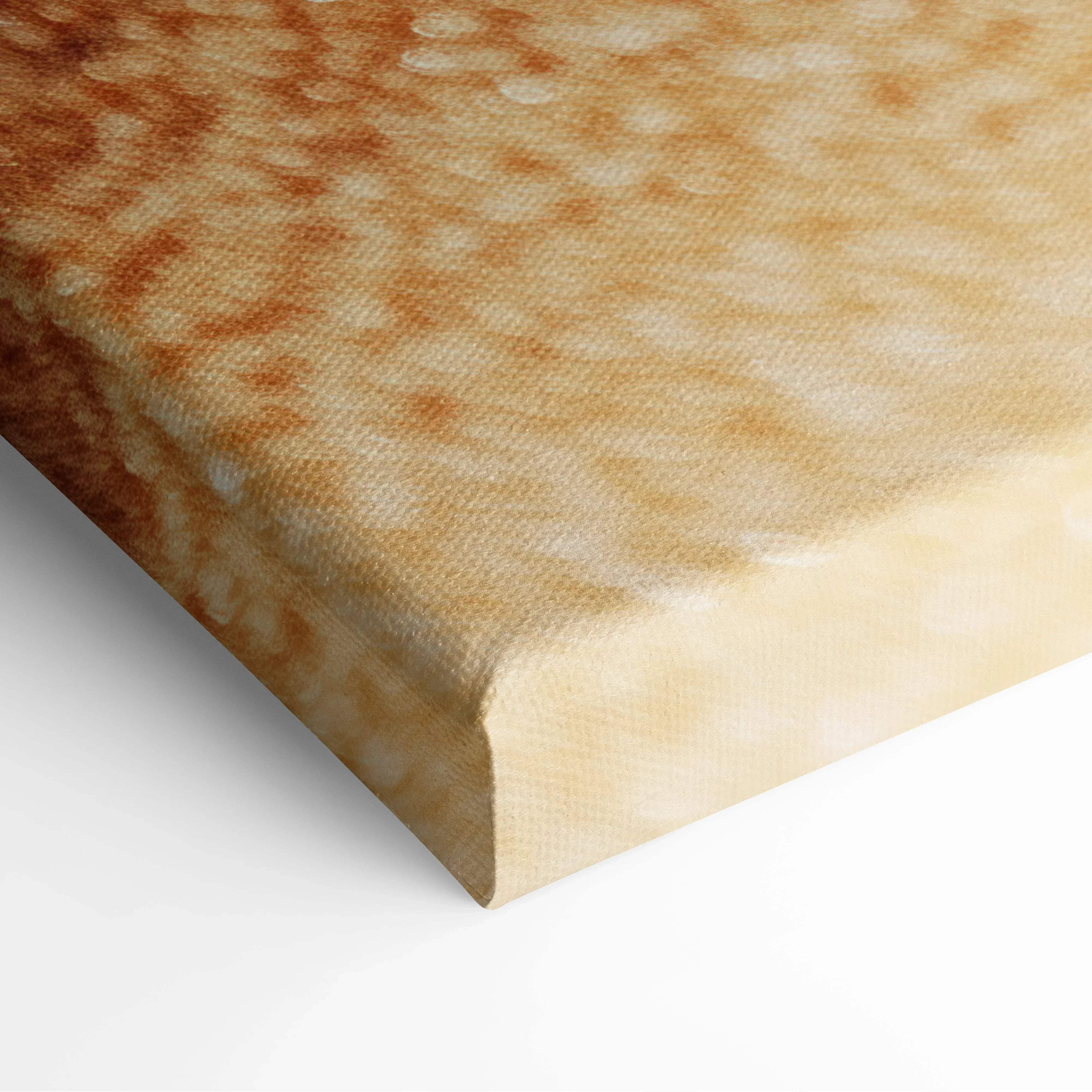 A canvas print showing a close-up of a golden-brown textured pancake with bubbles and slight browning in warm tones