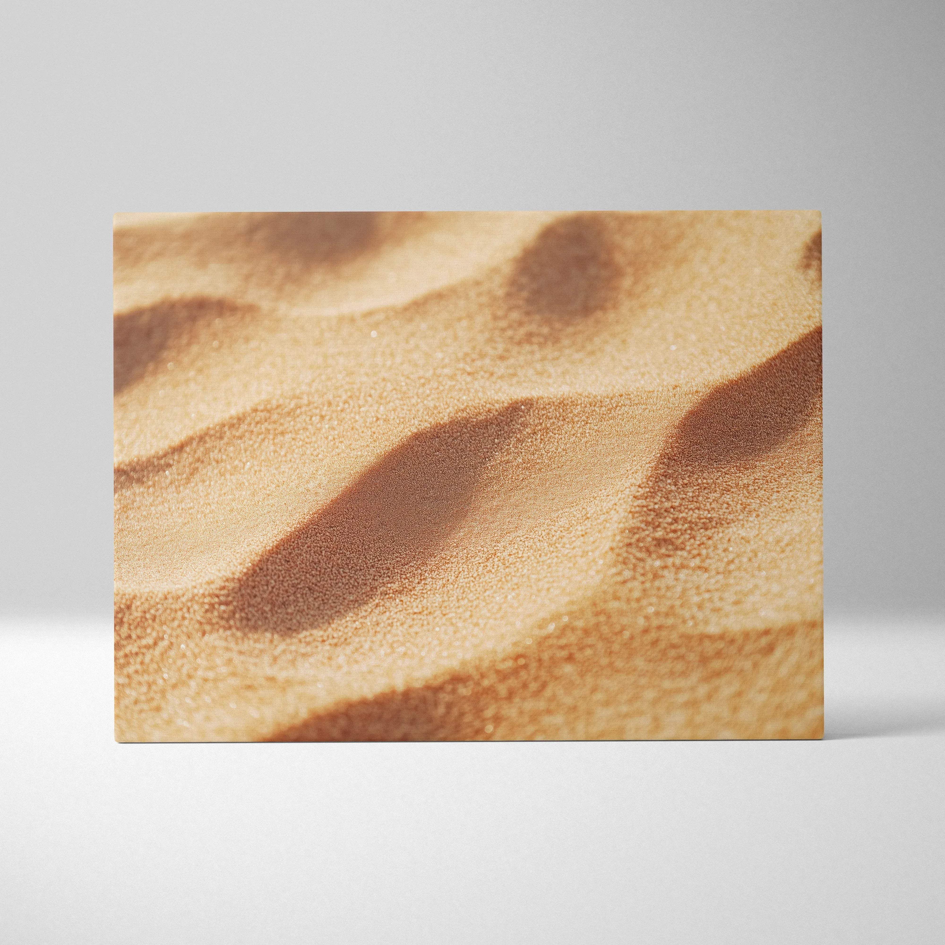 A rectangular canvas print of close-up textured golden-brown sand dunes with soft shadows in warm calming tones