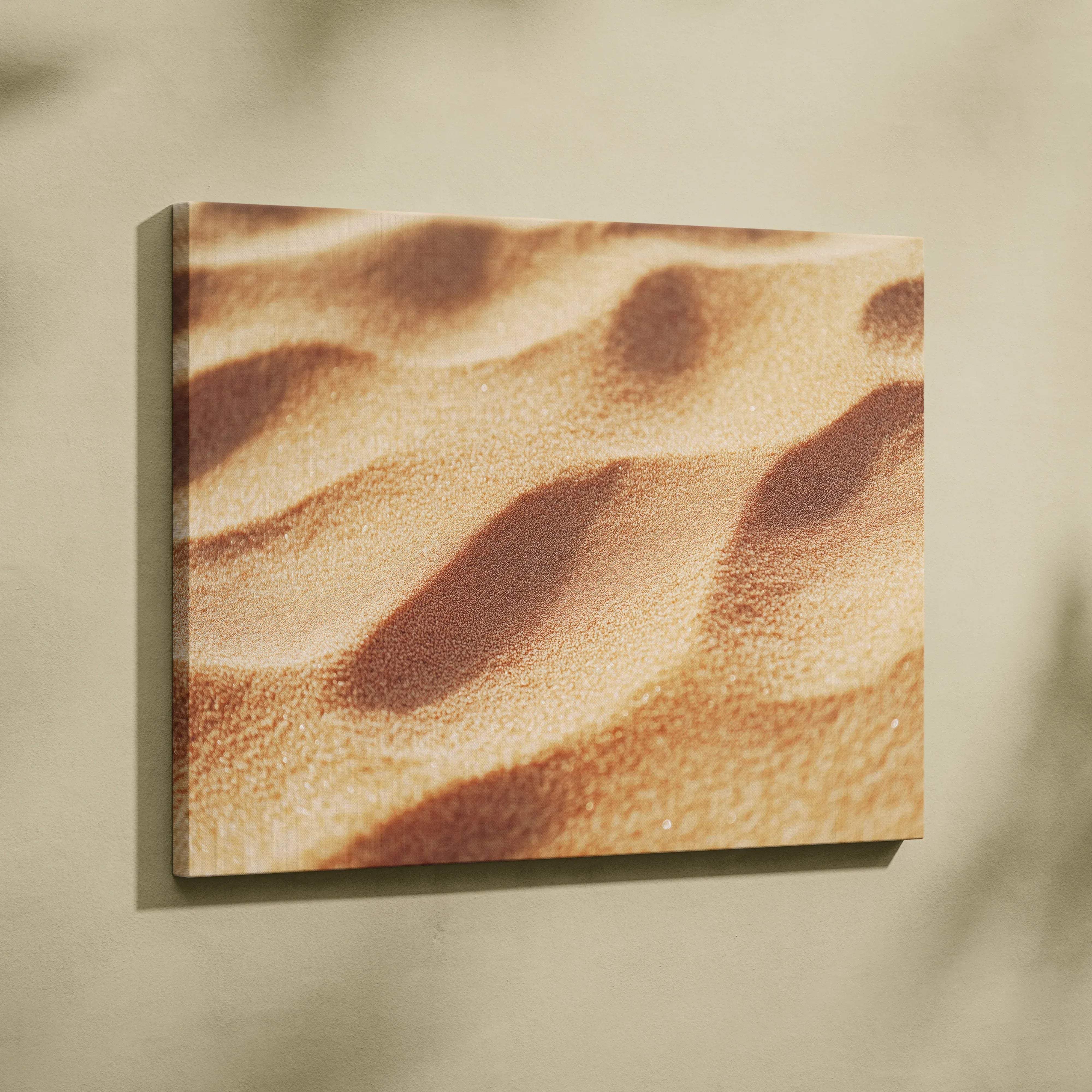A square canvas print featuring a textured golden-brown sand dune pattern with subtle shadowed ridges
