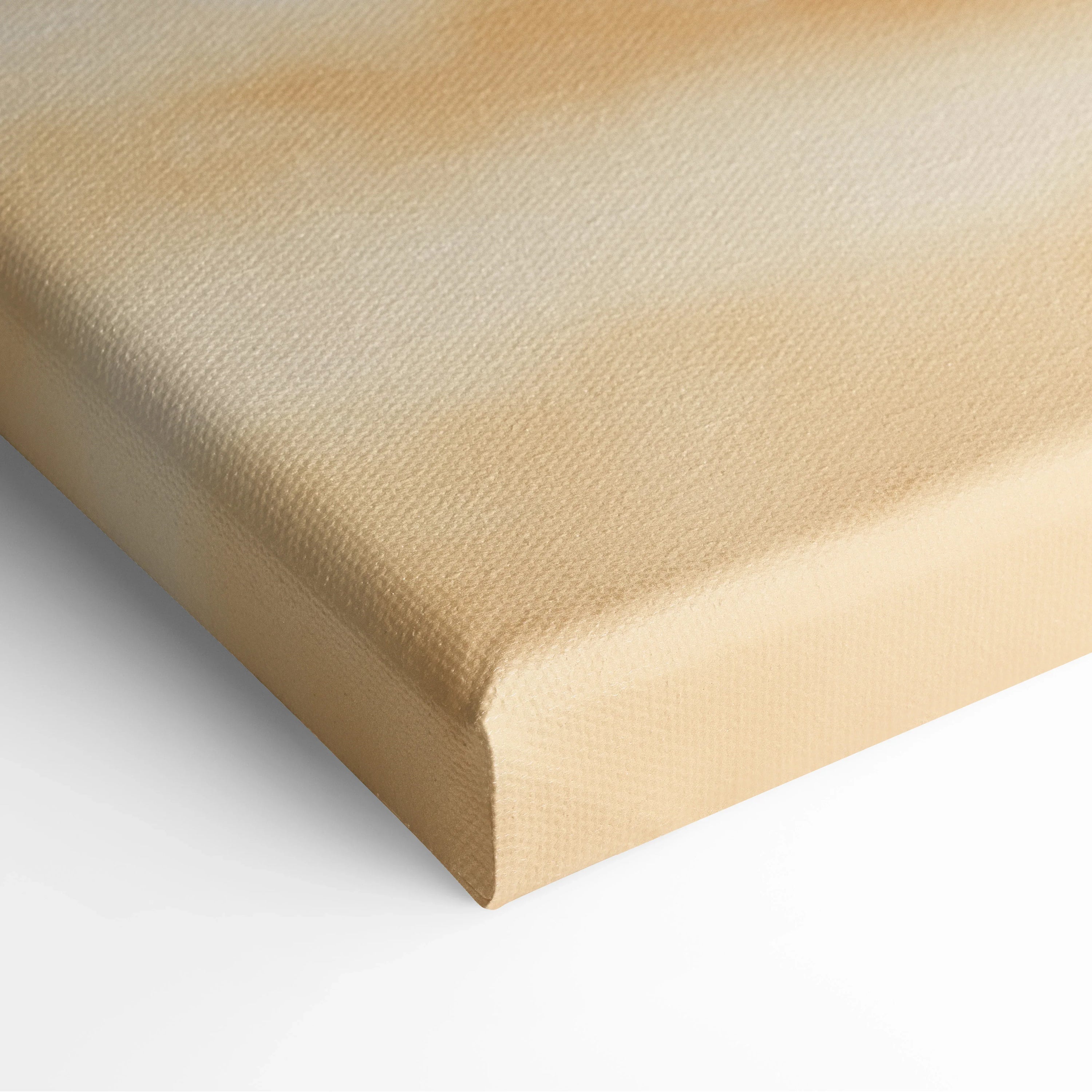 Close-up of canvas wall art with soft beige and sandy gradient texture resembling tropical beach sand.