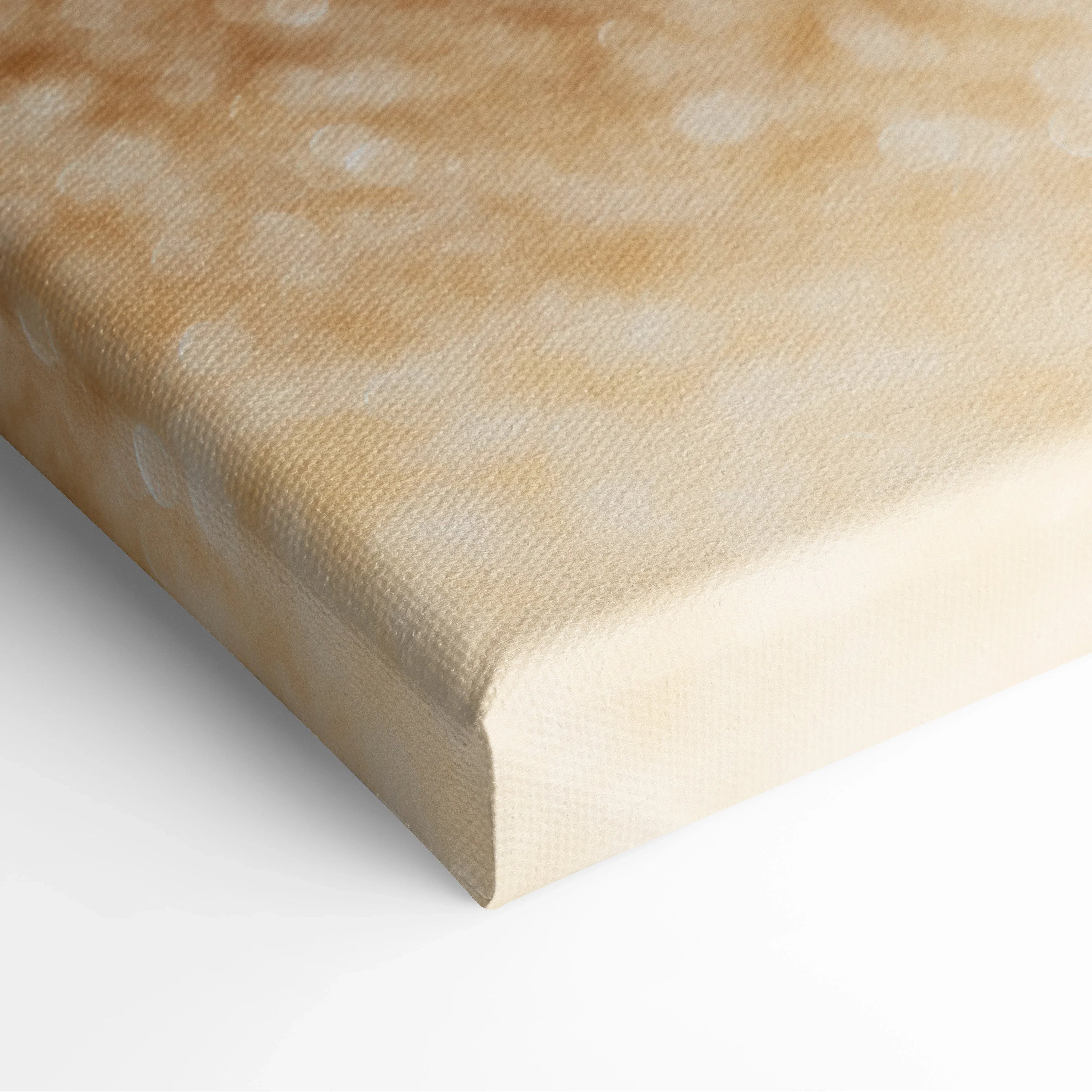 Canvas wall art featuring a close-up digital print of beige and light tan beach sand texture with subtle shadows and grain.