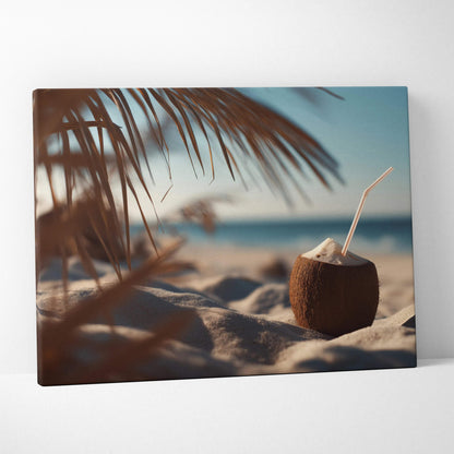 Canvas wall art featuring a tropical coconut drink with a straw on sandy beach under palm leaves.