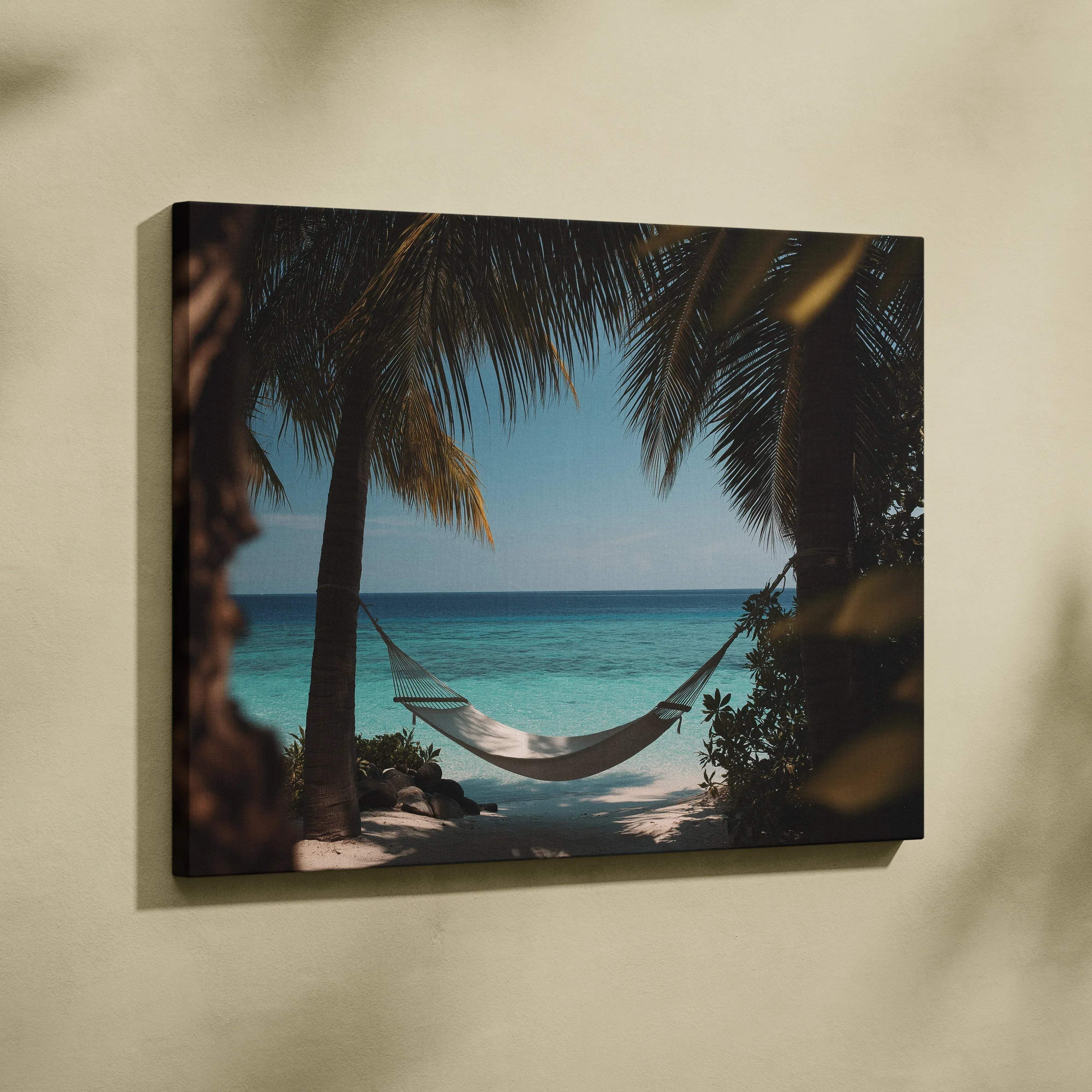 Beige canvas wall art featuring a tropical beach scene with a hammock between palm trees over ocean view in coastal blues