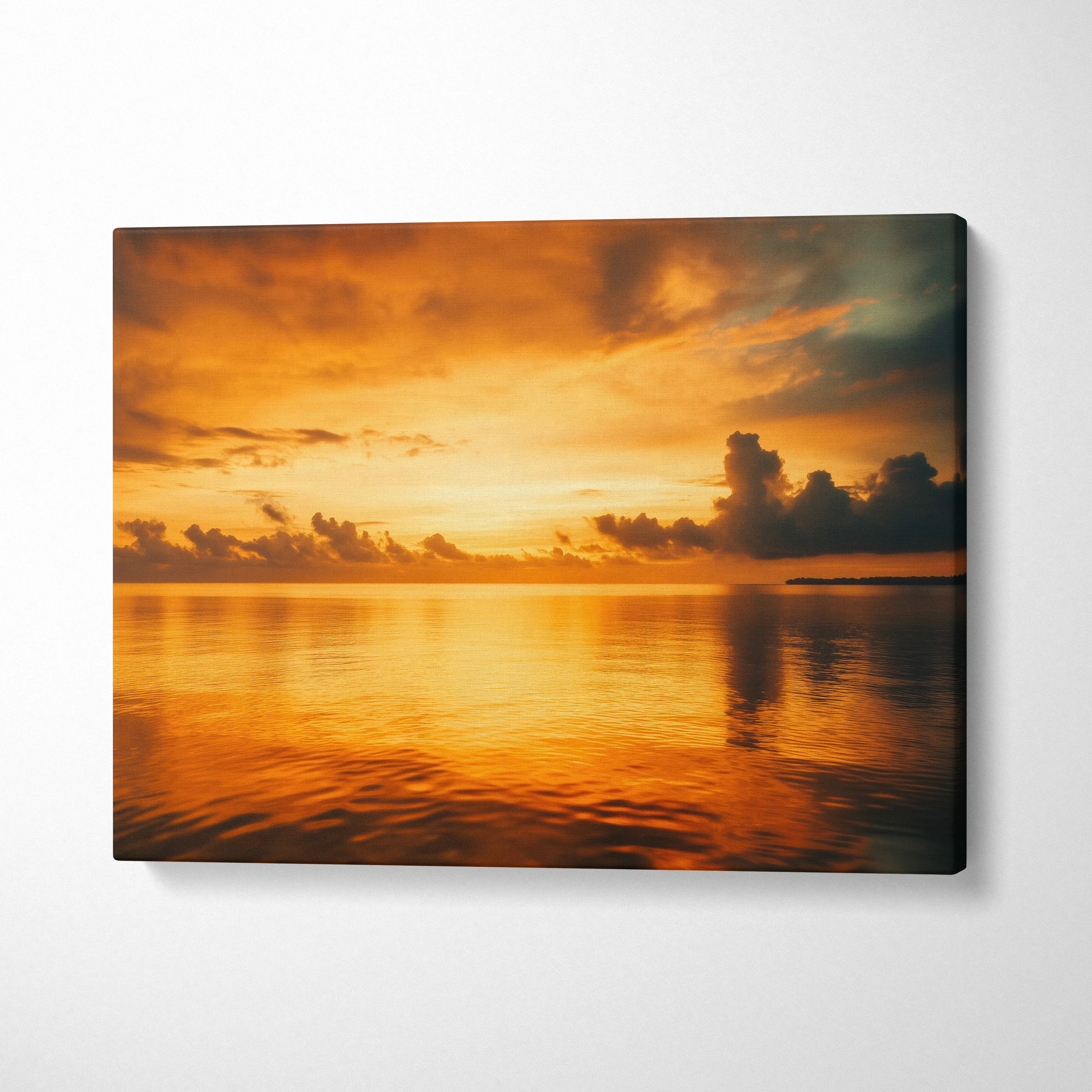 Sunset ocean scene with glowing clouds over calm water on canvas wall art decor.