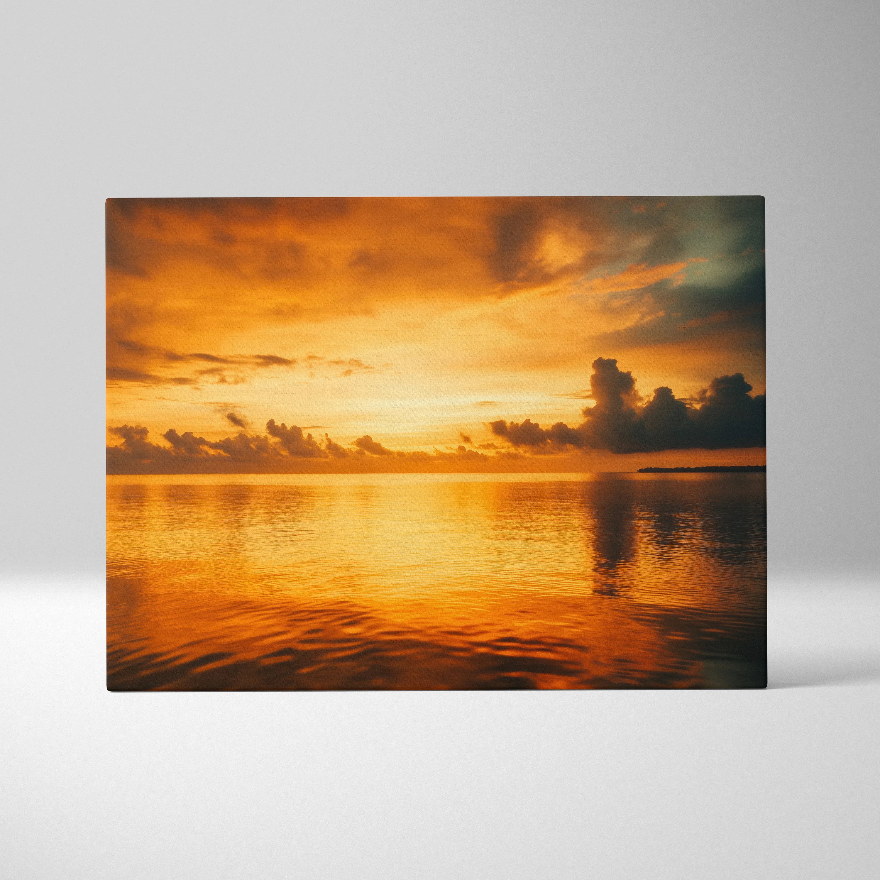 Canvas wall art featuring a vivid orange and gold sunset over calm ocean waters with scattered clouds.