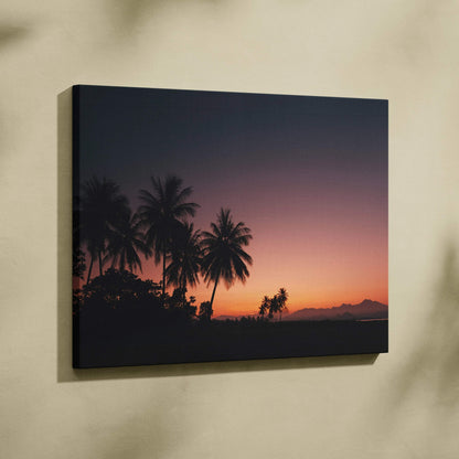 Canvas wall art featuring a tropical sunset with dark silhouette palm trees against a gradient dusk sky.