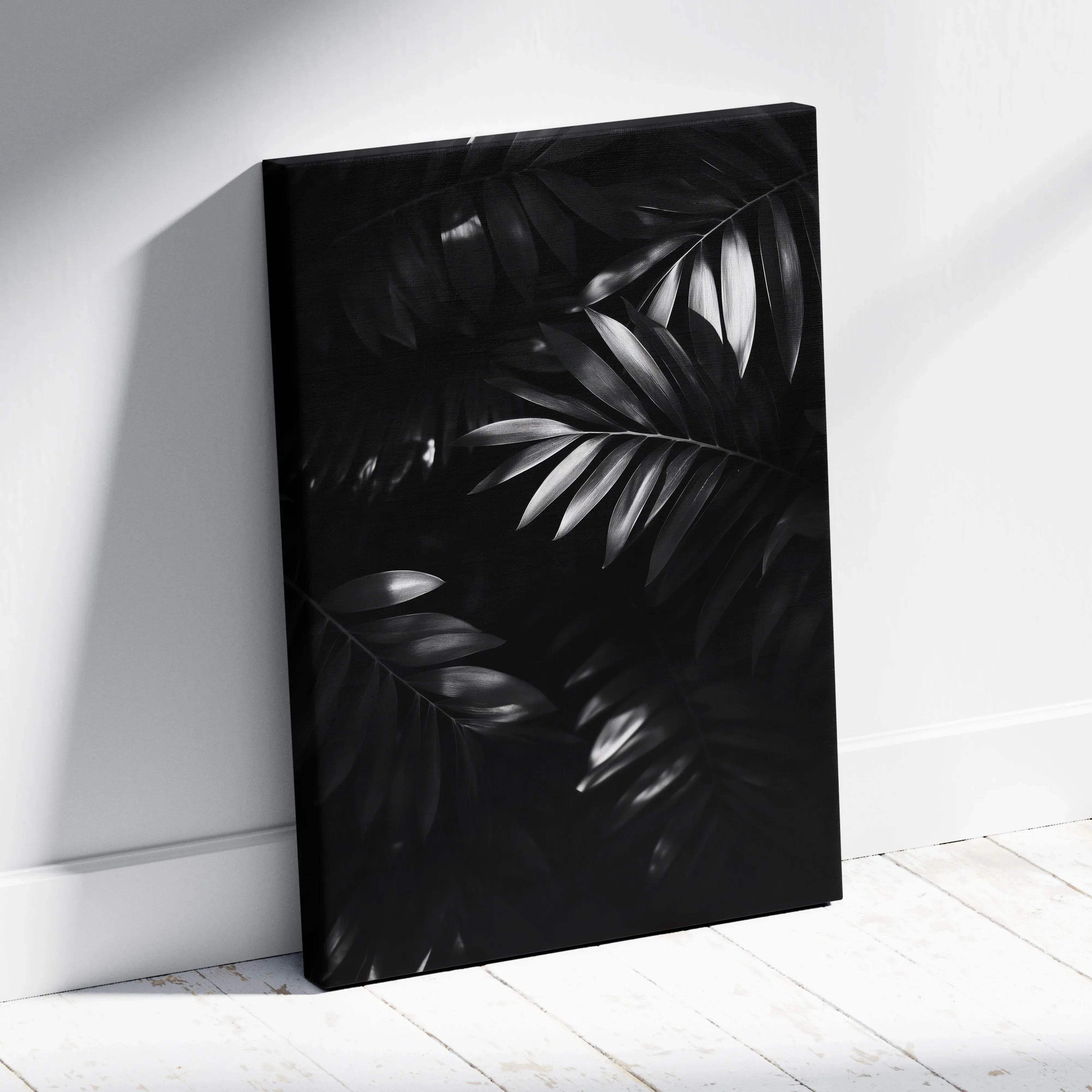 Black and white digital canvas art print of overlapping tropical palm leaves with a matte finish.