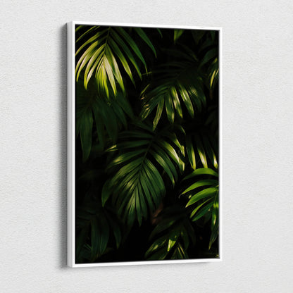 Canvas wall art featuring dark green tropical leaves with detailed shadows and highlights on a black background.