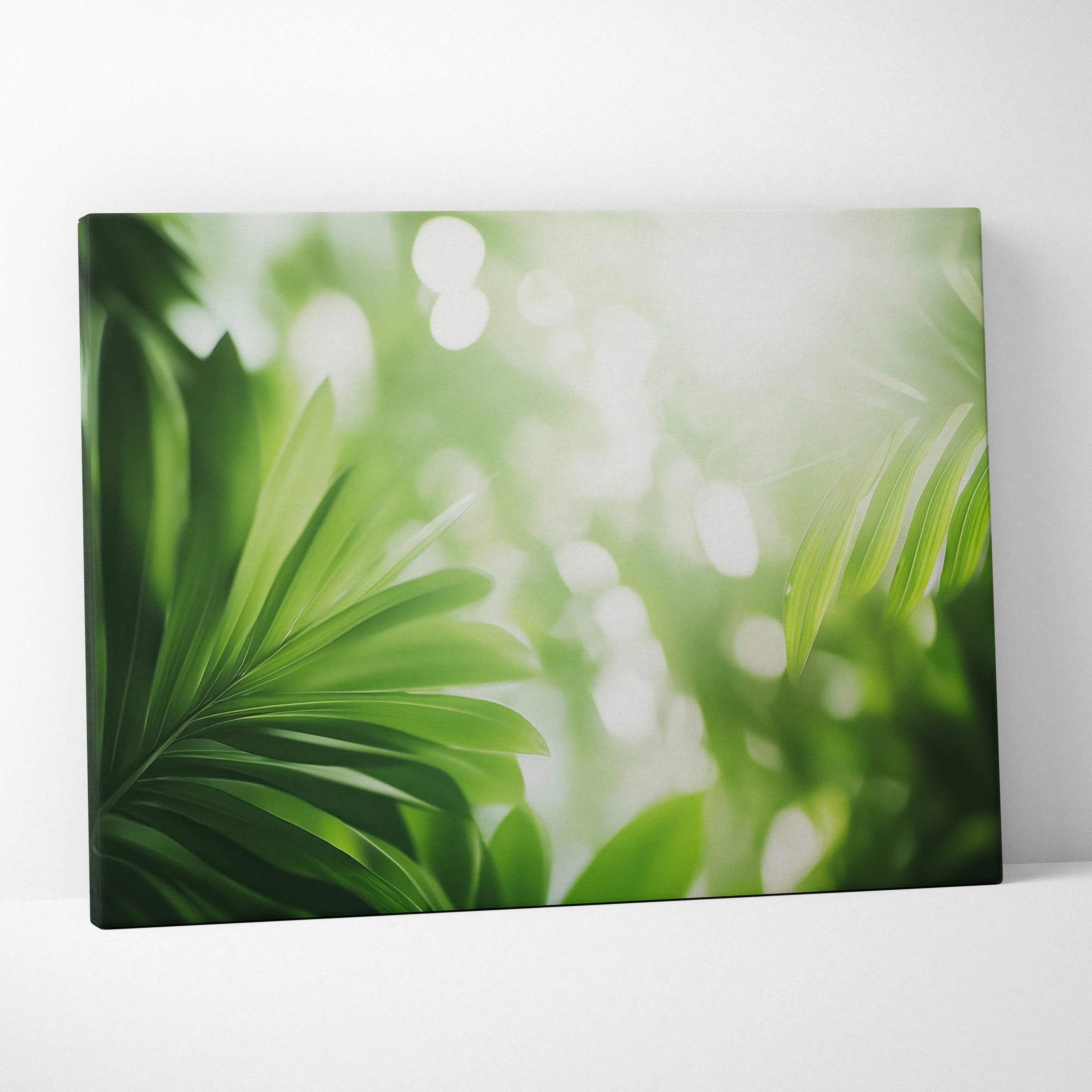 Green tropical leaves with sunlight flare on canvas wall art with soft blurred background.