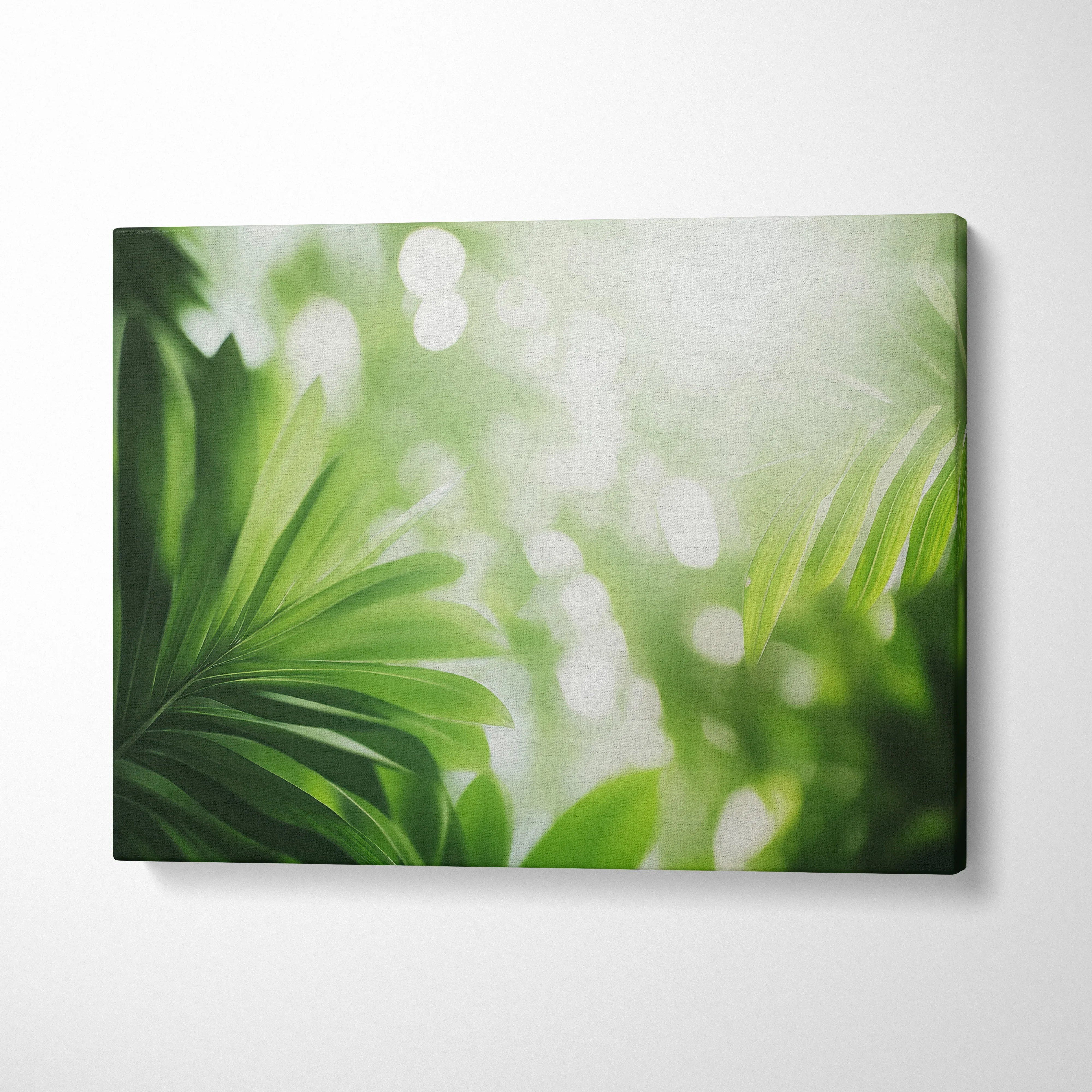 Tropical green leaves with sun flare on canvas wall art with soft focus decor background.