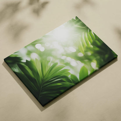 Canvas wall art featuring vibrant green tropical leaves with sun flare and soft light effects.