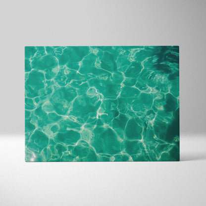 Turquoise sea water pattern on rectangular canvas wall art with light reflections and ripples.