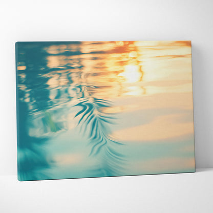 Canvas wall art featuring abstract tropical water reflection in vibrant teal, orange, and yellow hues.