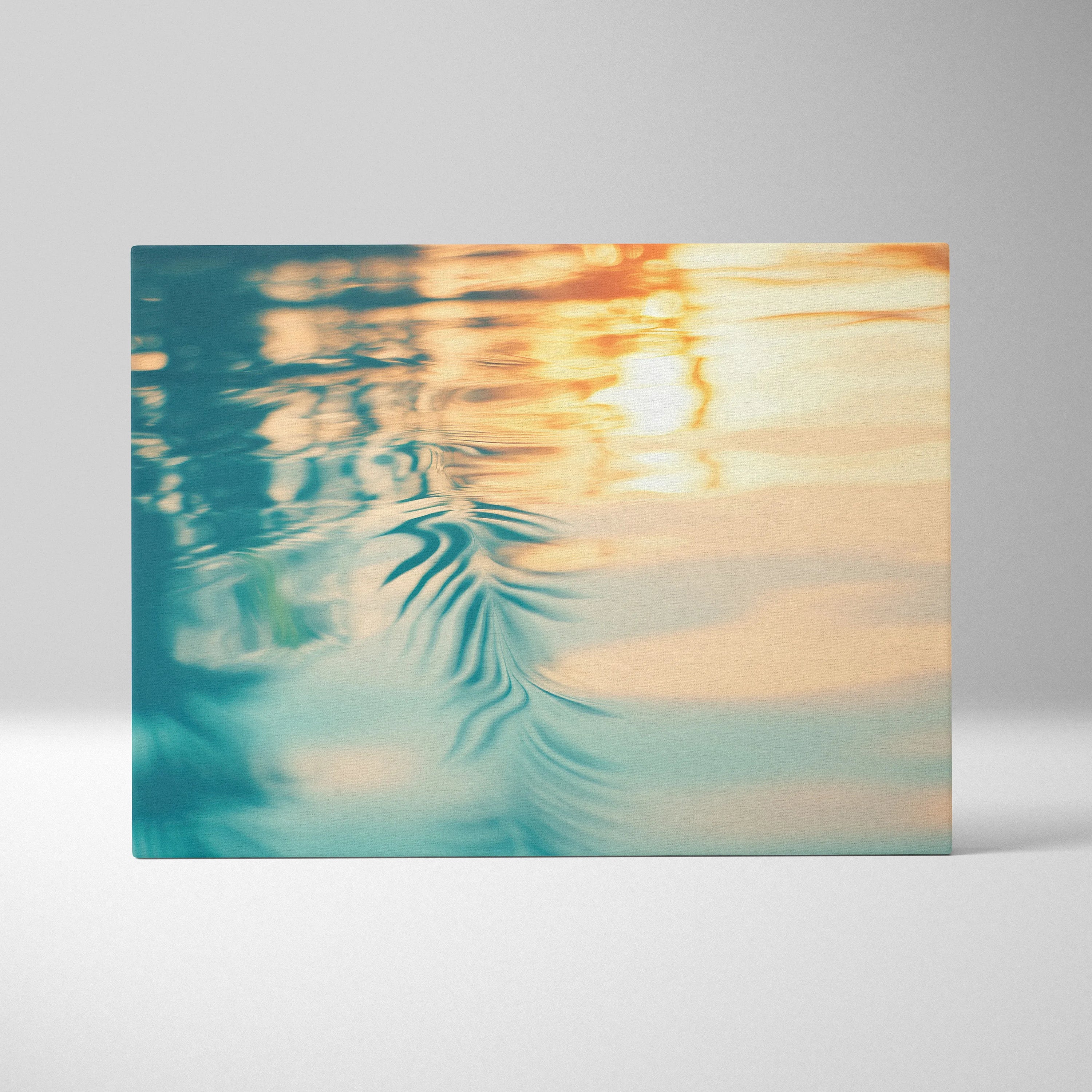 Canvas wall art featuring a tropical sunset with warm orange and teal water reflections.