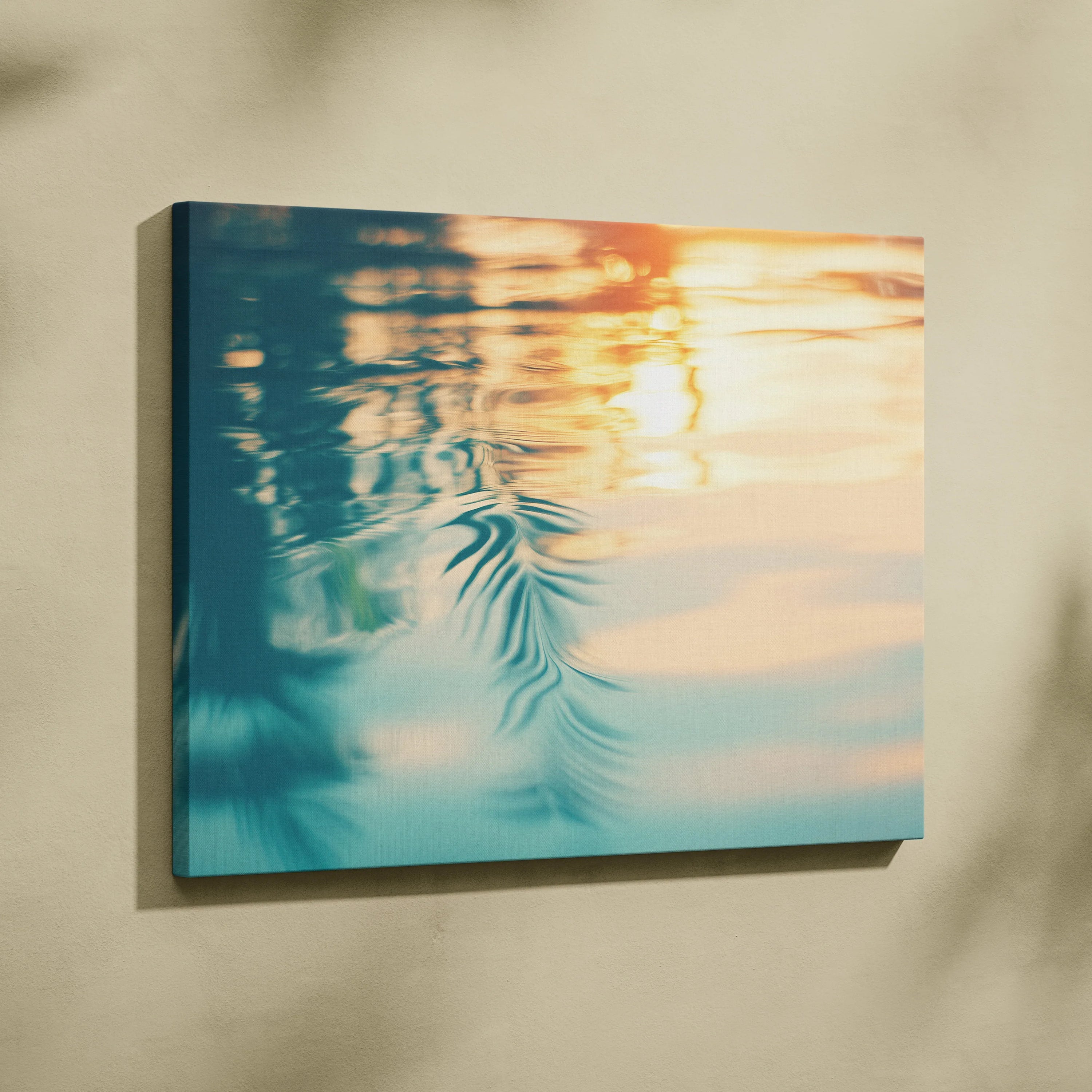 Canvas wall art featuring a tropical sunset reflected softly on rippling water in warm blue and orange tones.