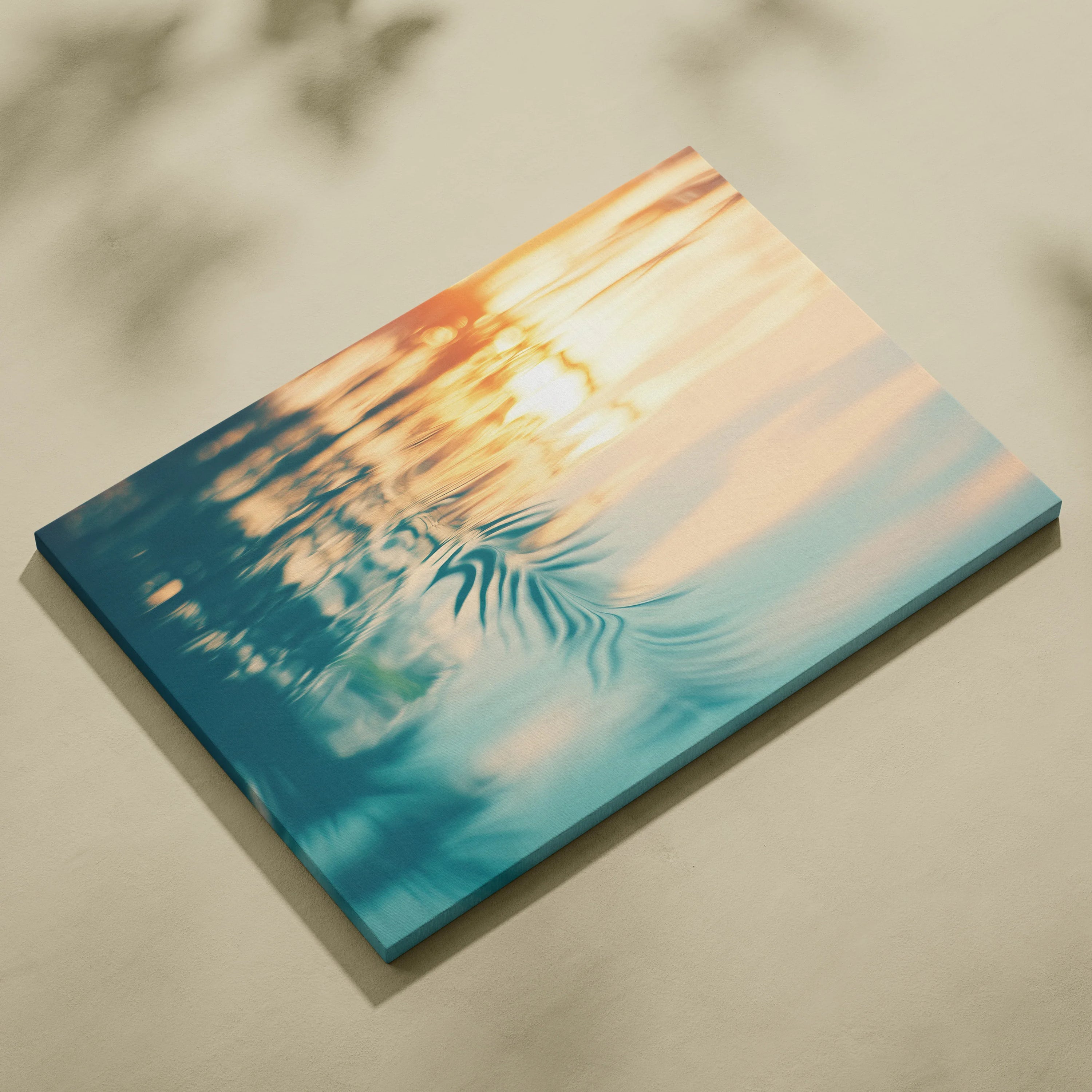 Canvas wall art featuring a tropical sunset with orange and blue water reflections and palm leaf silhouettes.