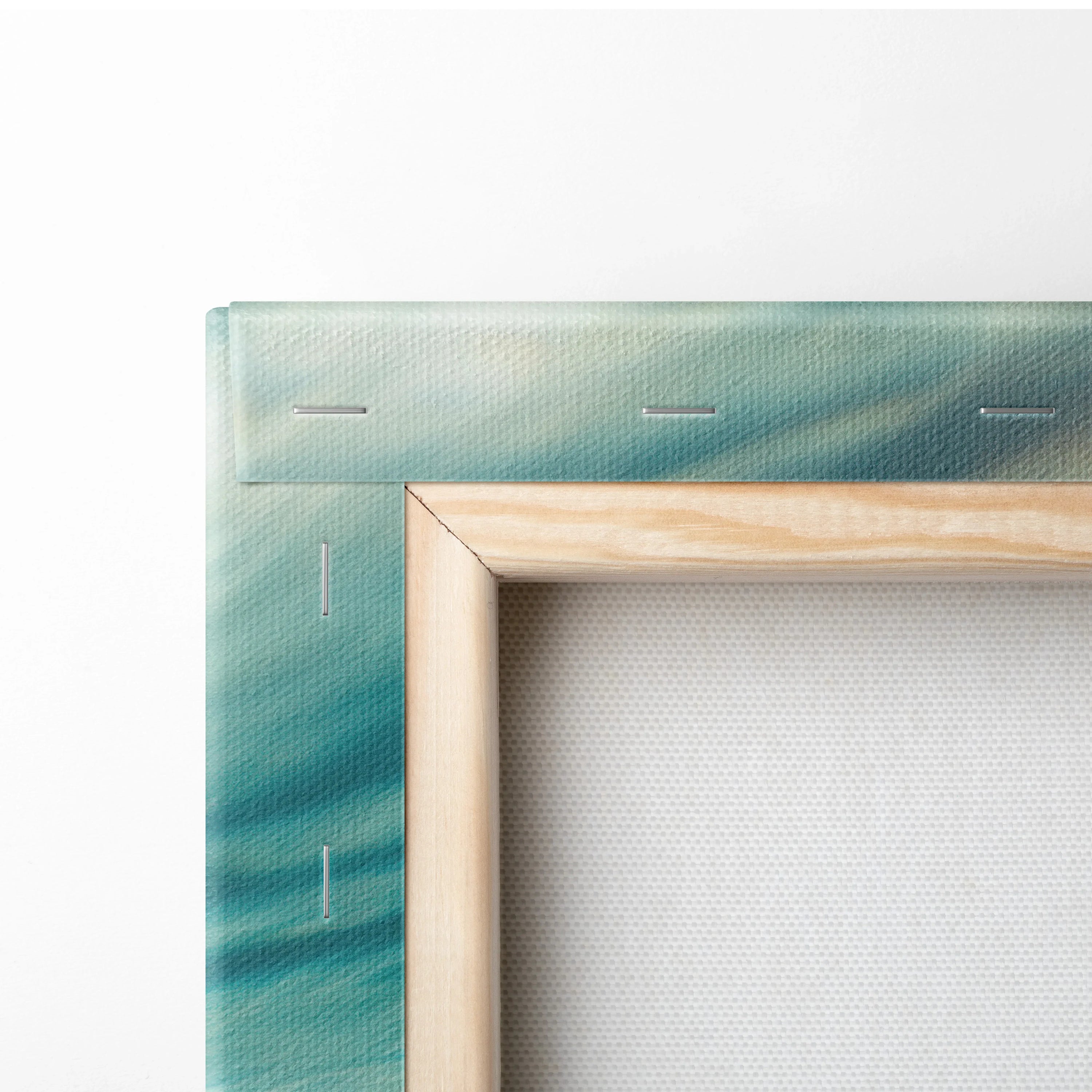 Close-up of wooden stretcher frame with canvas featuring blue-green underwater ocean scene and subtle sun rays.