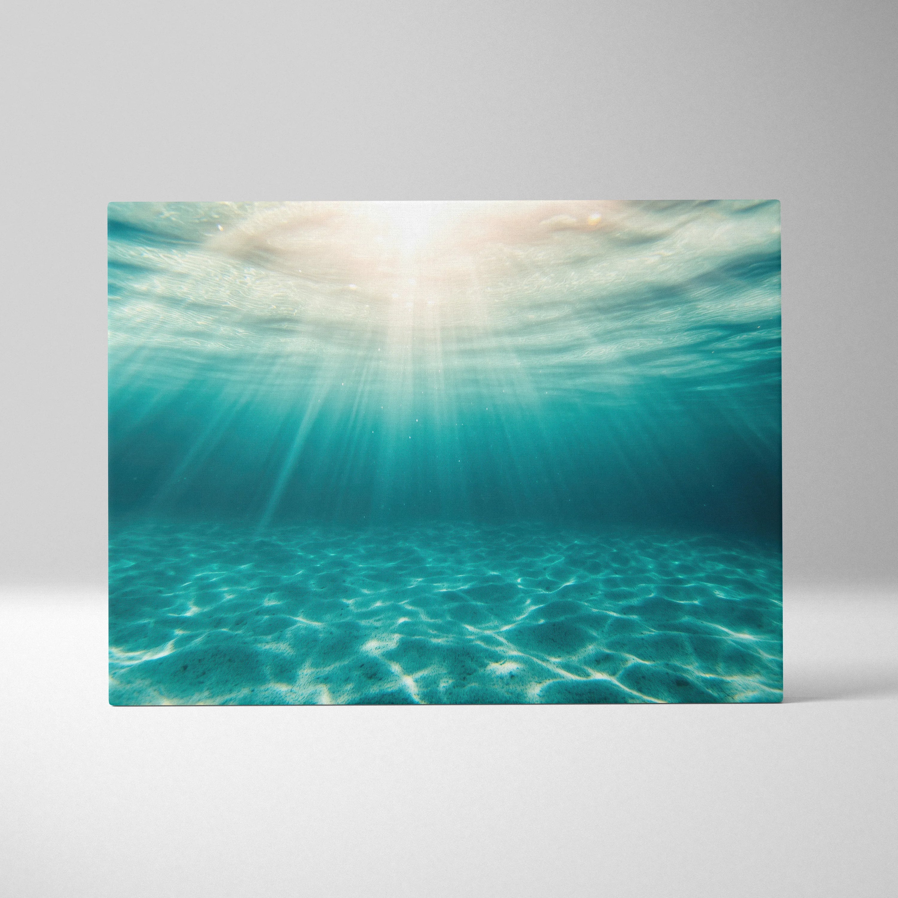 Canvas wall art featuring vibrant underwater ocean scene with sun rays filtering through turquoise water for tropical home.