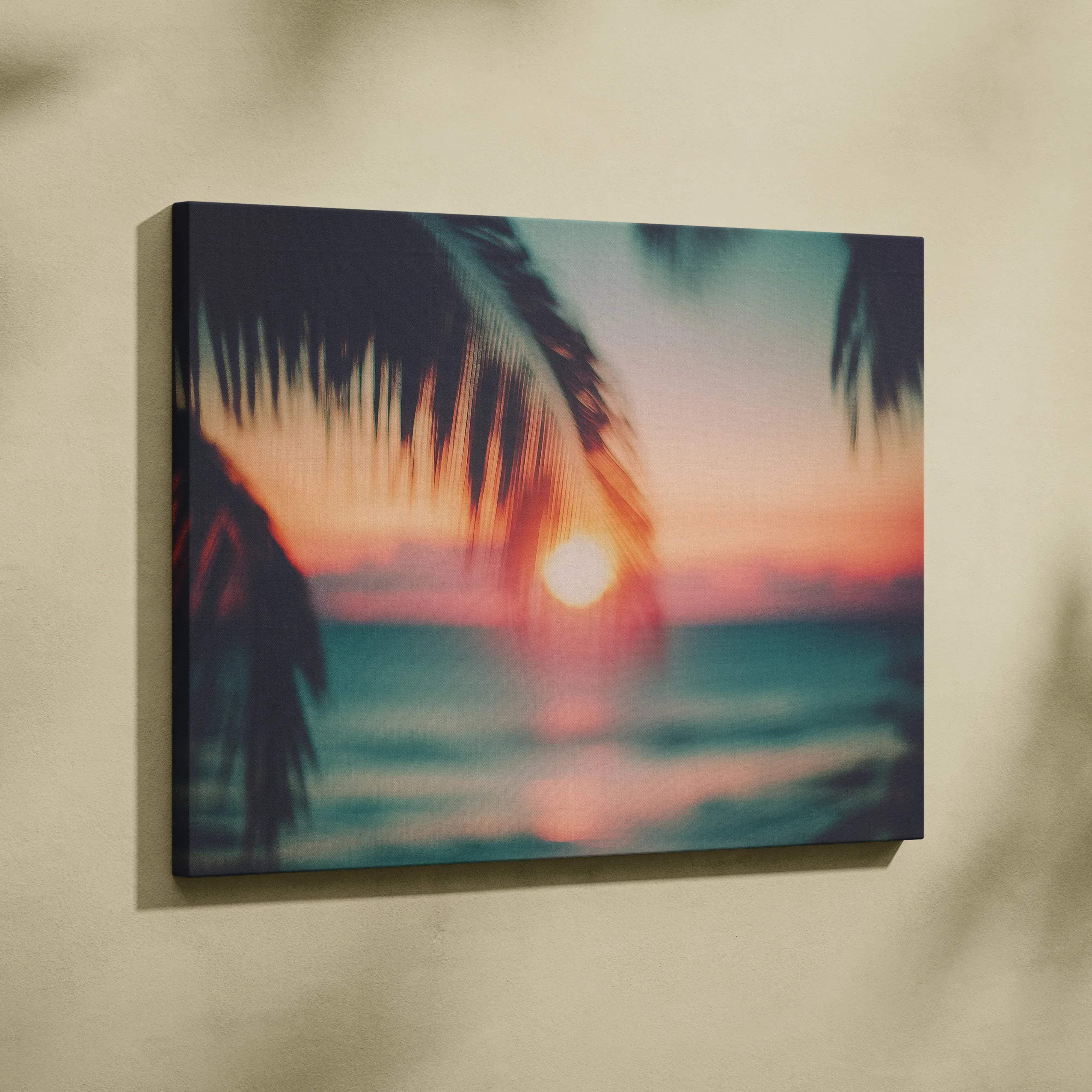 Tropical sunset canvas wall art featuring vibrant beach scene with silhouetted palm fronds in warm golden glow