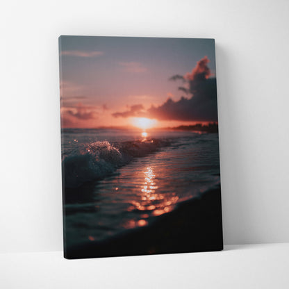 Canvas wall art featuring a tropical beach sunset with reflective waves and warm orange-pink sky tones.