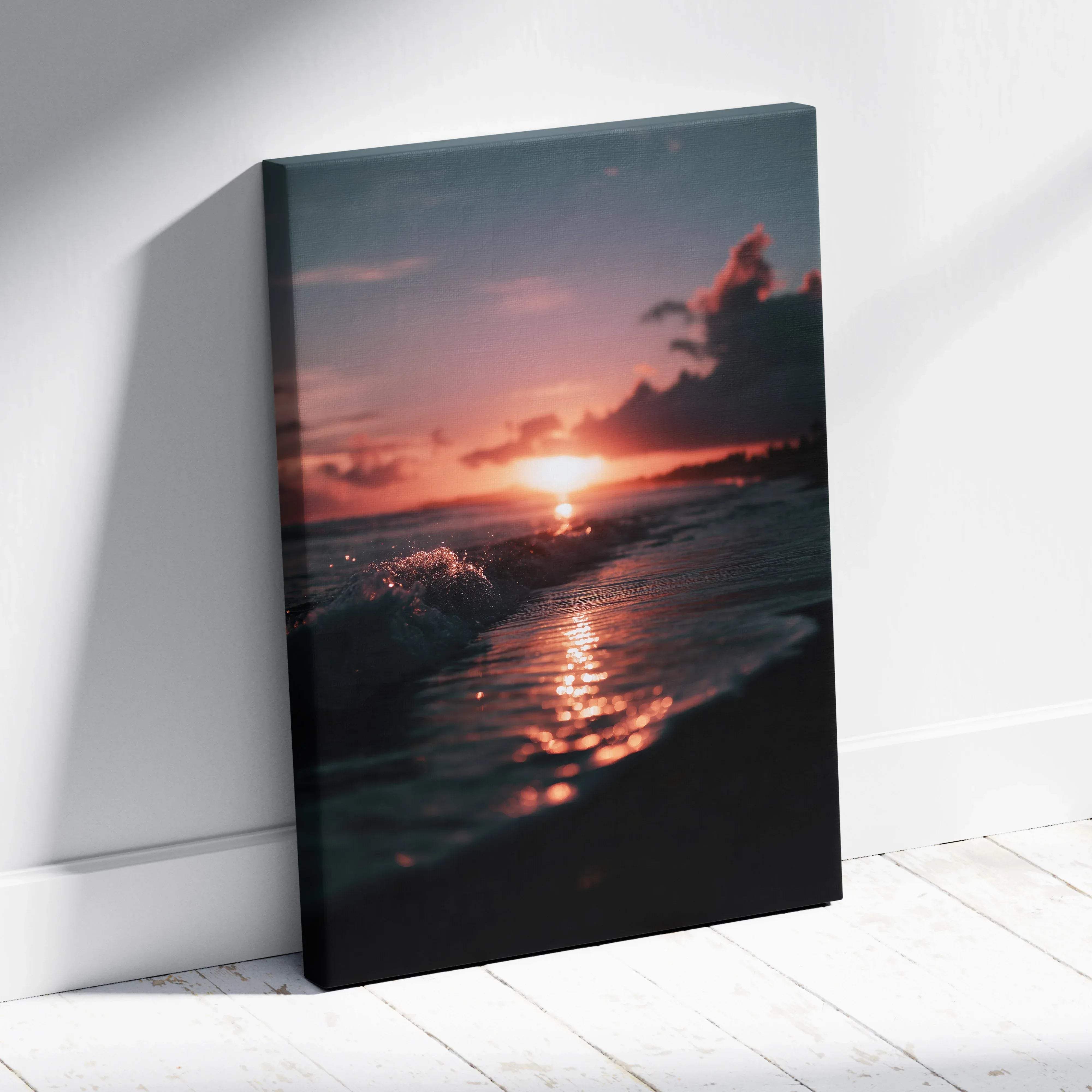 A framed canvas print showing a tropical sunset coastal scene with warm orange and pink hues over dark ocean waves