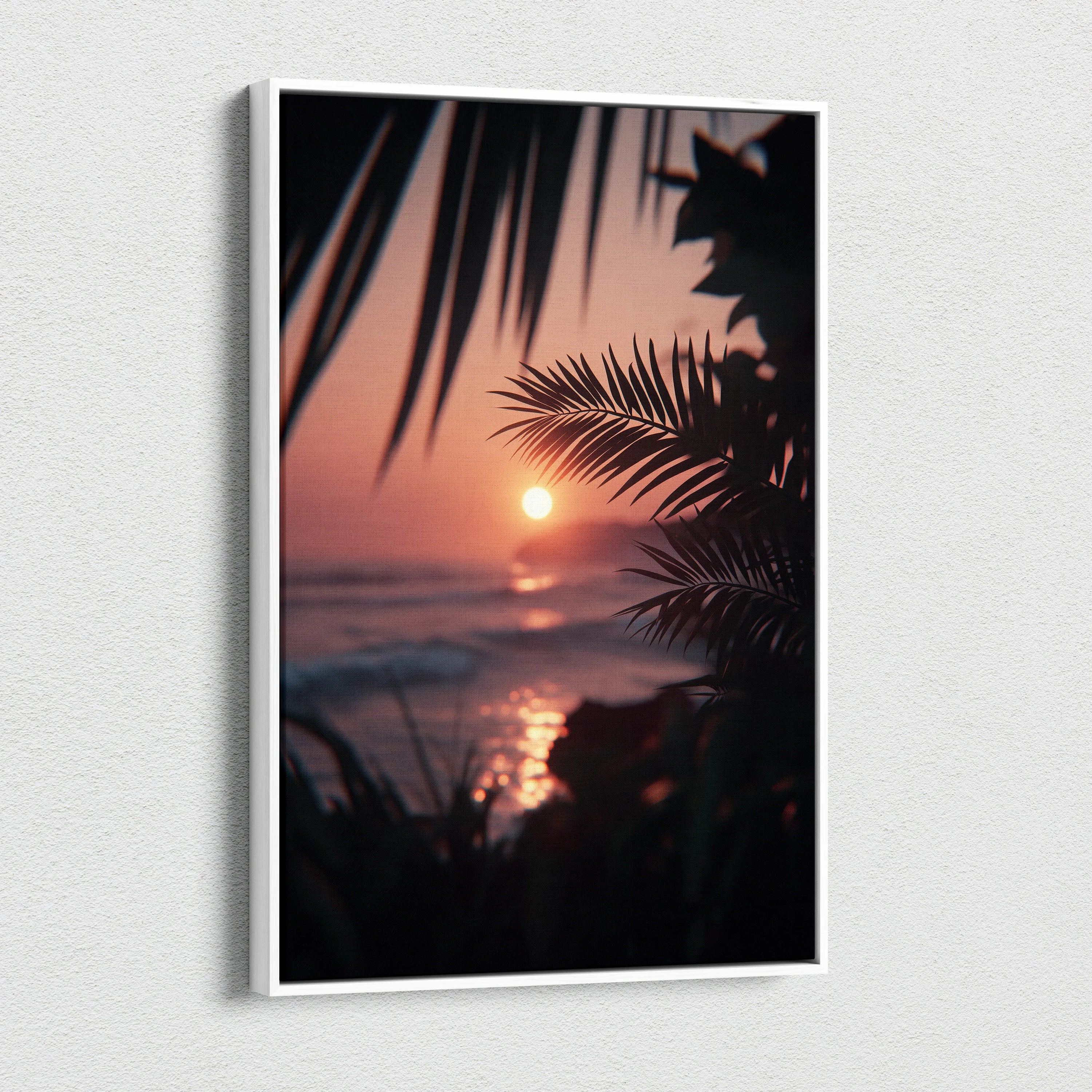Vertical canvas wall art featuring a tropical sunset with palm leaves silhouetted over ocean waves.