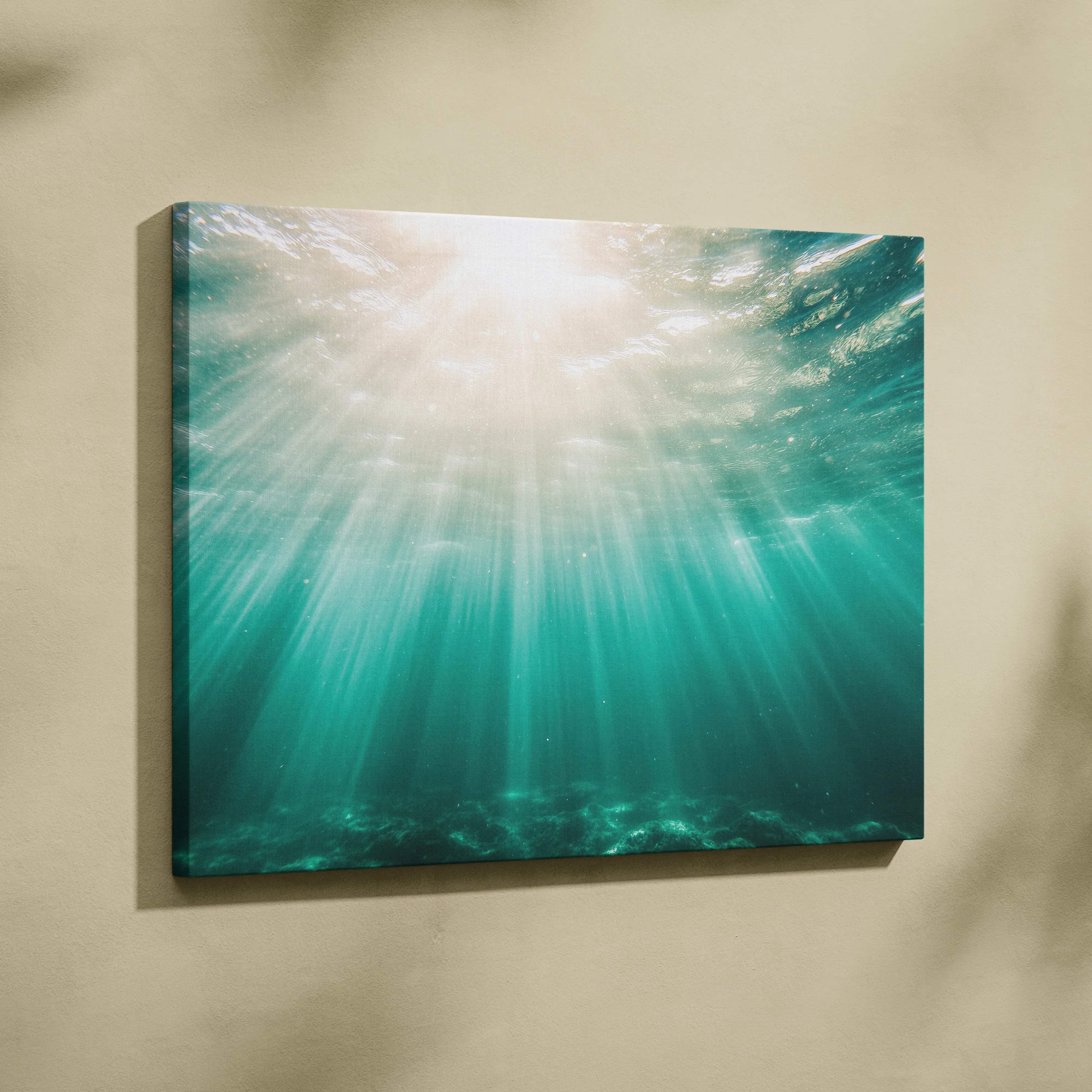Tropical underwater sun rays canvas wall art featuring teal ocean glow seascape with sun rays piercing water for living room decor