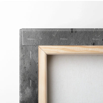 Corner close-up of a stretched white canvas on natural wood frame with visible staples and gray back lining for wall art.
