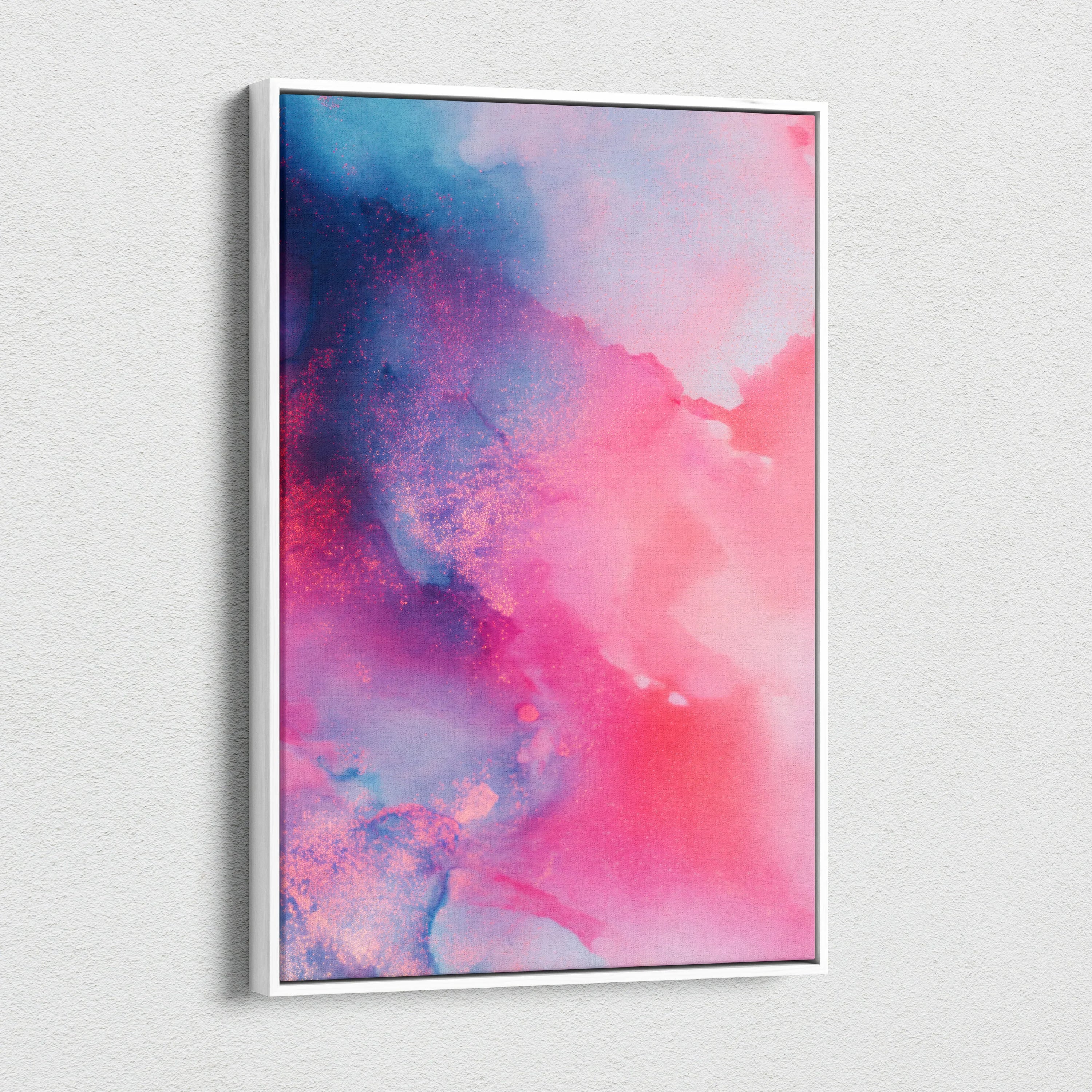 Abstract nature canvas wall art in vibrant pink and blue hues with a subtle textured effect.