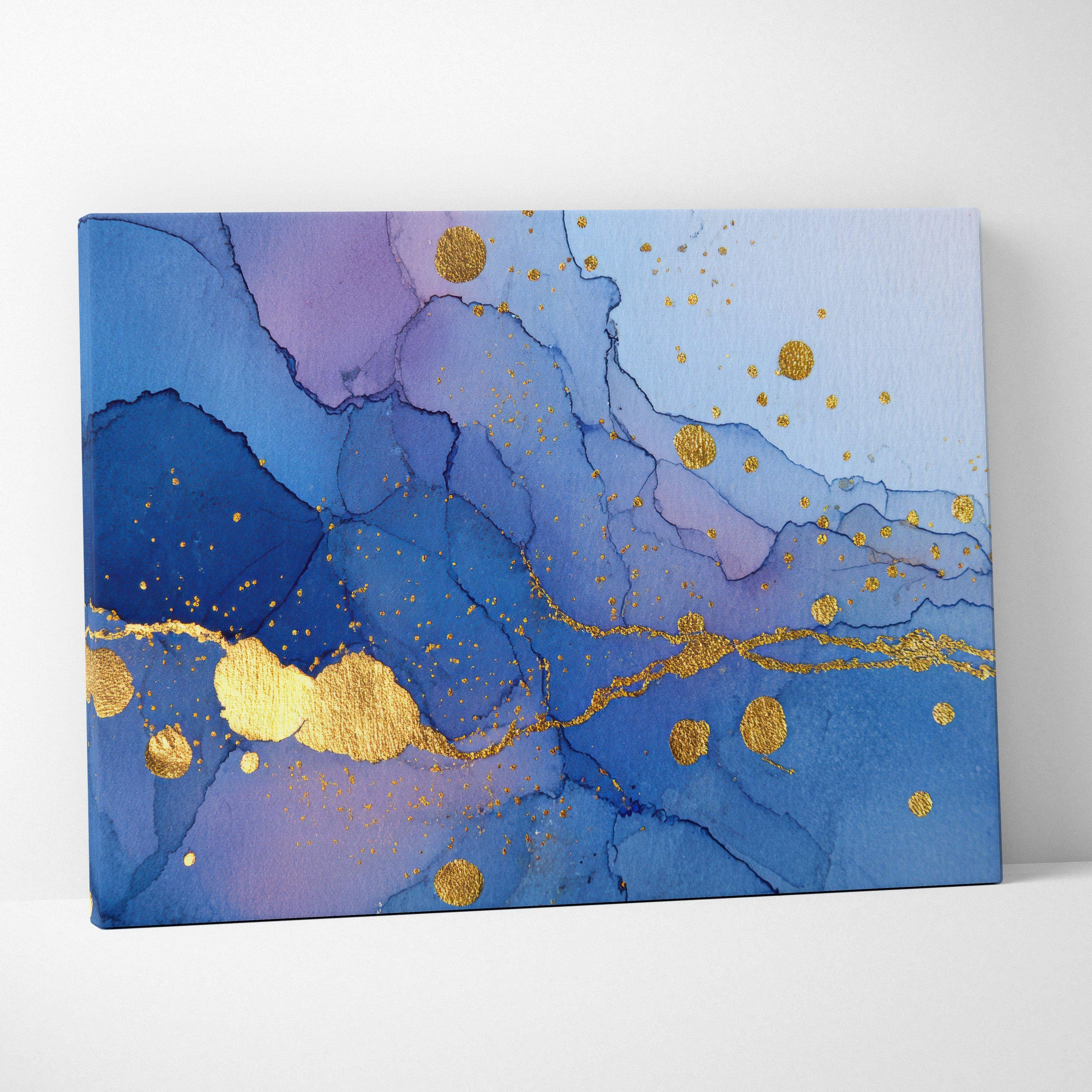 Coastal luxe abstract fluid art canvas wall art featuring blue and purple waves with gold leaf accents