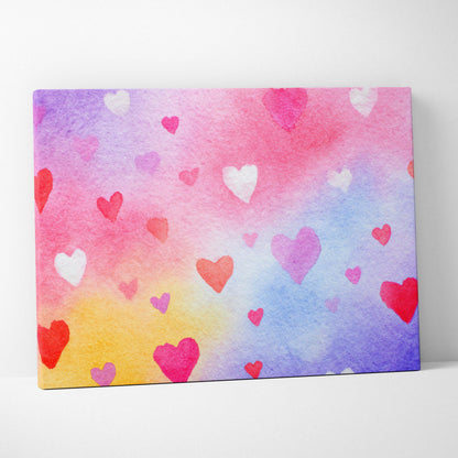 Colorful watercolor background with various pink and red heart shapes on canvas wall art.