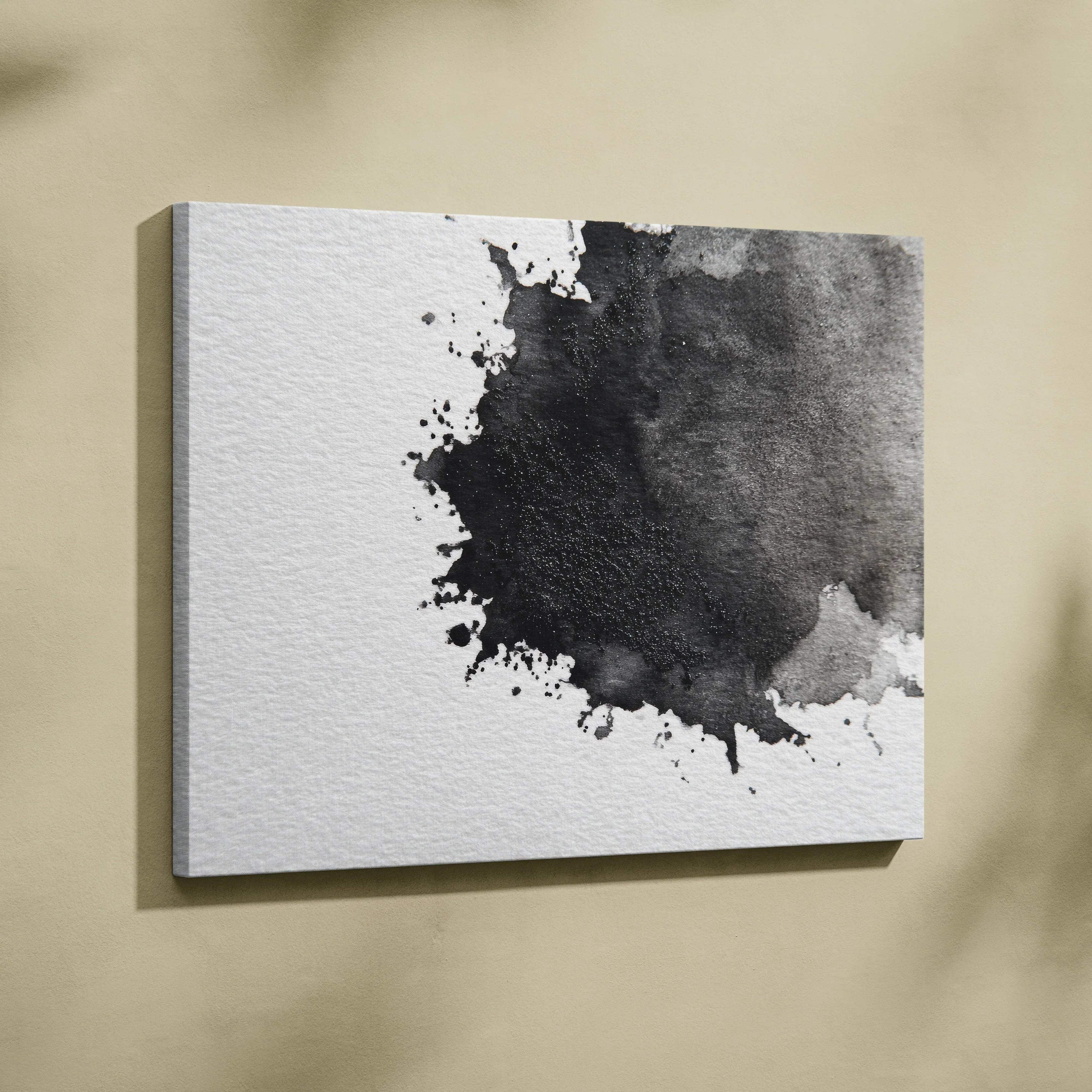 Abstract black and gray ink splash on white canvas wall art with textured canvas surface.