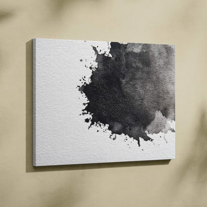 Abstract black and gray ink splash on white canvas wall art with textured canvas surface.