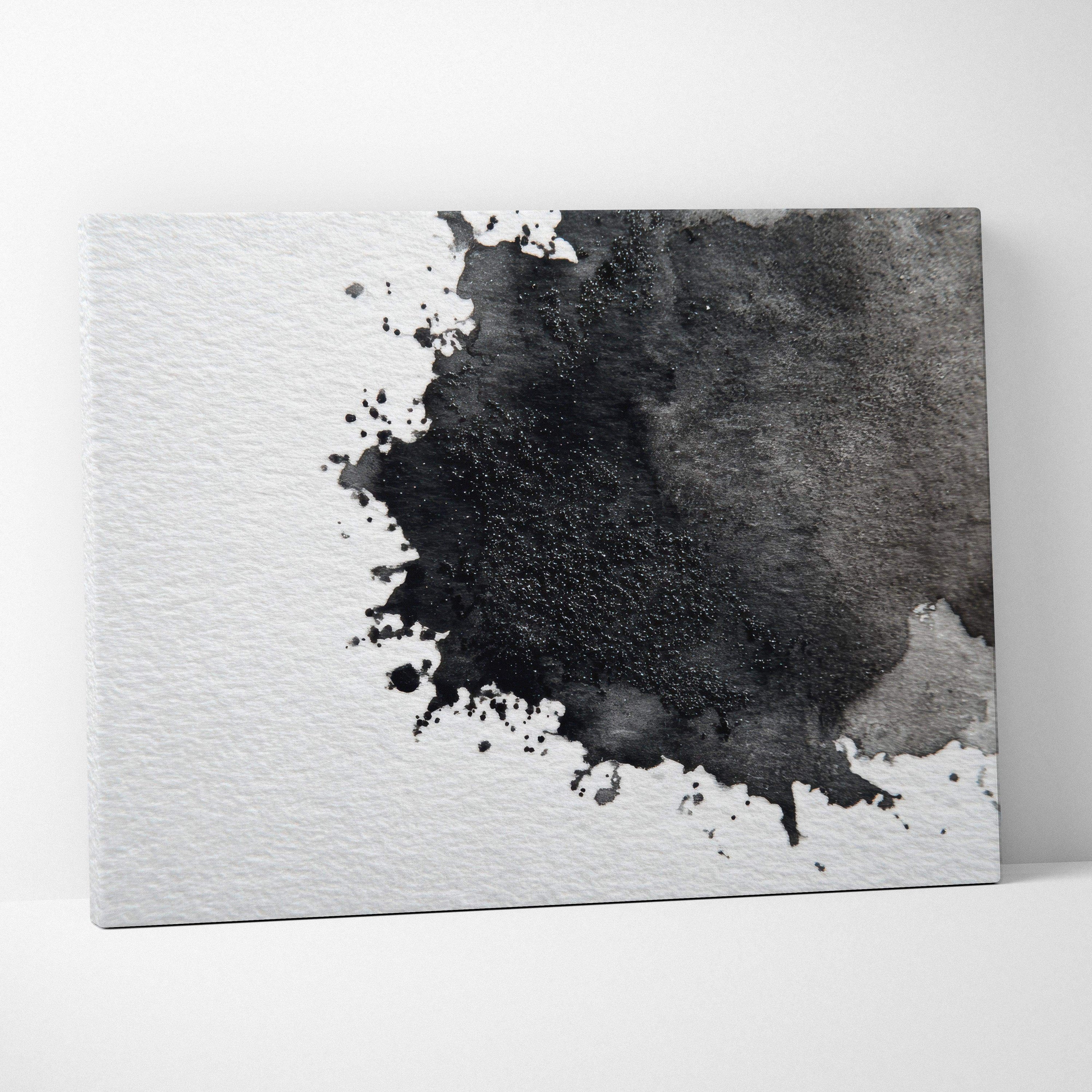 Abstract black ink splash on white textured canvas wall art with subtle gray accents.