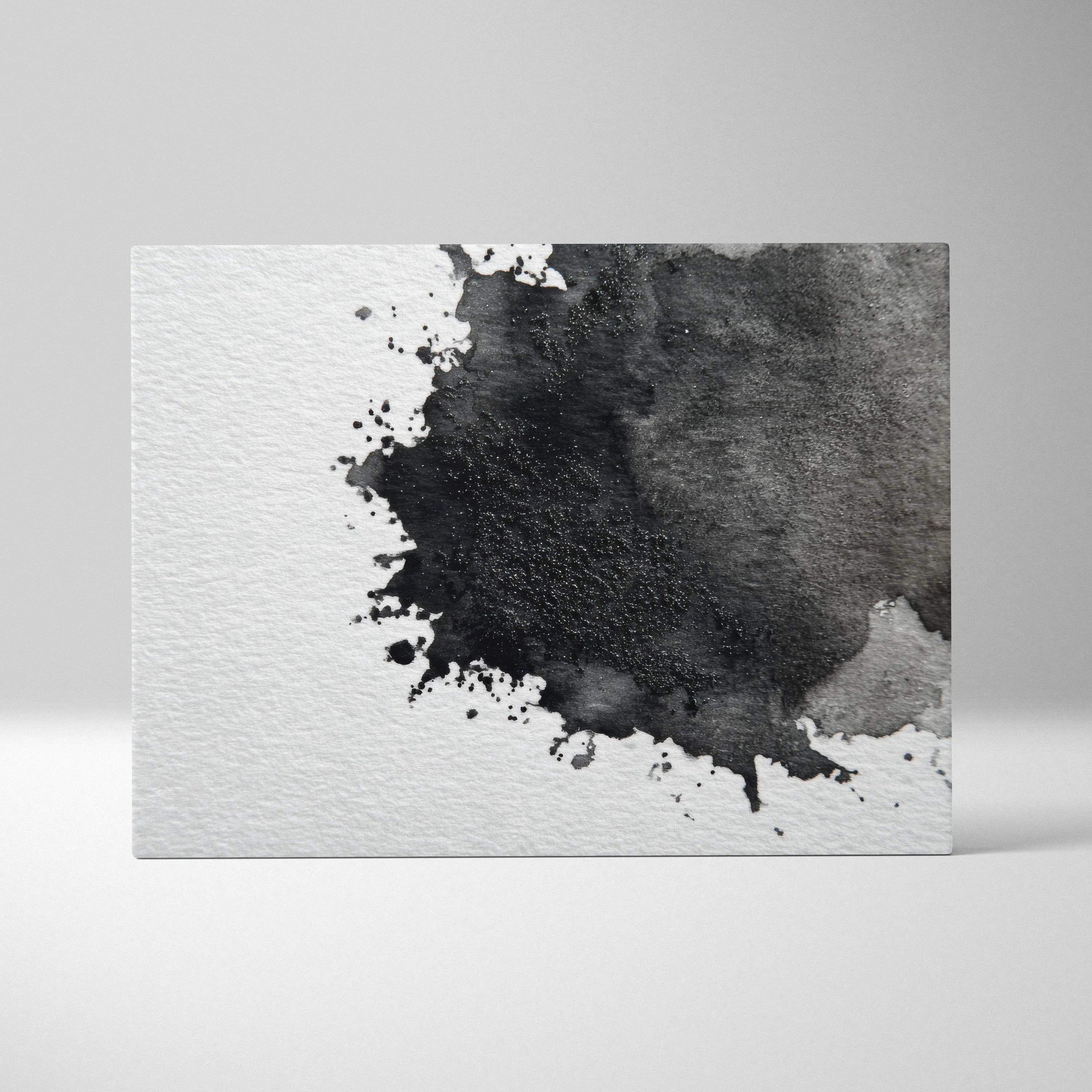 Abstract black and gray watercolor splash on white textured canvas wall art.