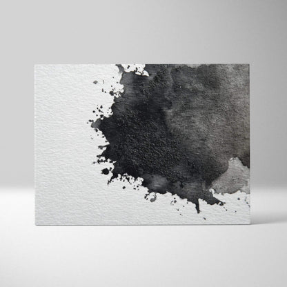 Abstract black and gray watercolor splash on white textured canvas wall art.
