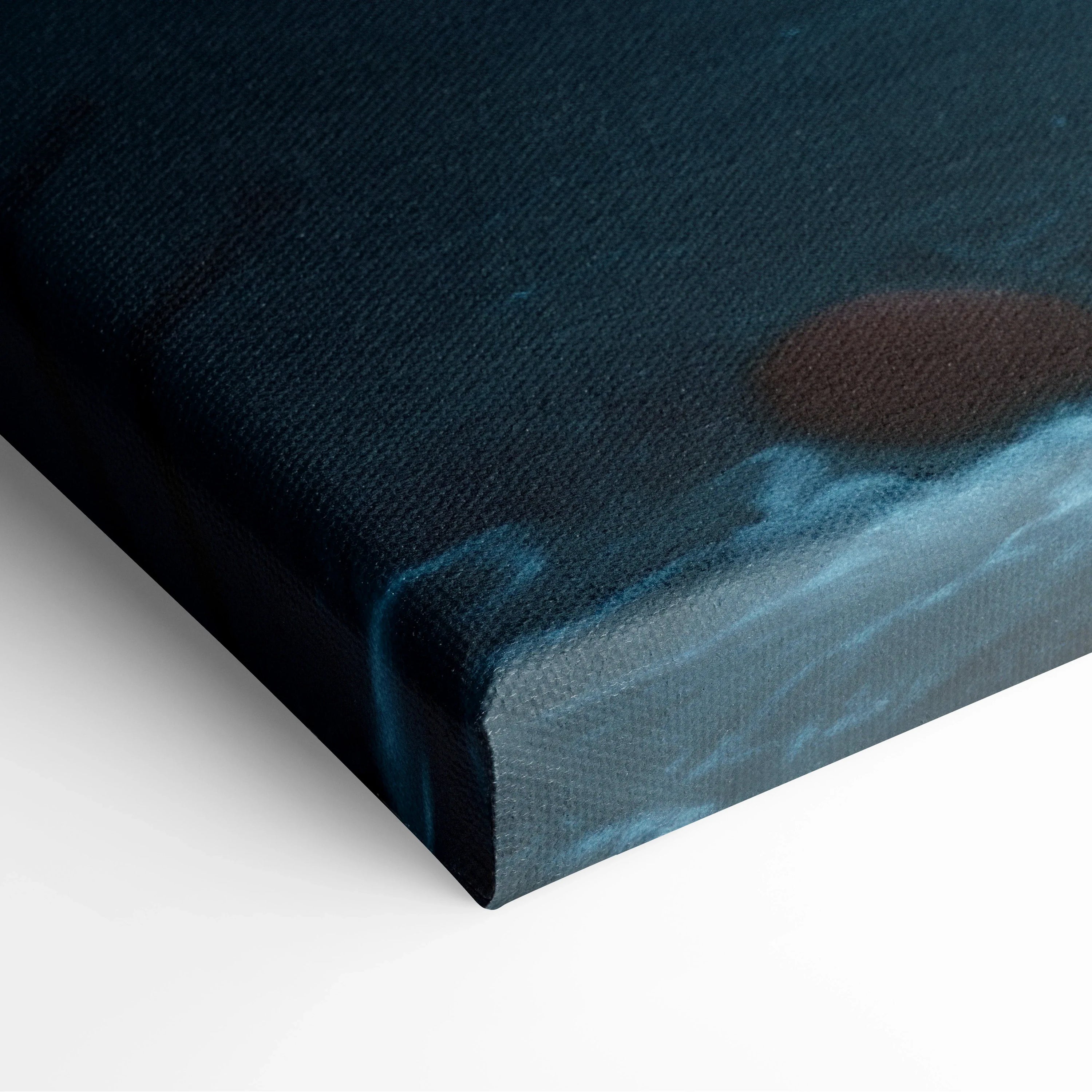 Close-up of waterfall canvas wall art with glowing blue and red light accents on textured decor canvas.
