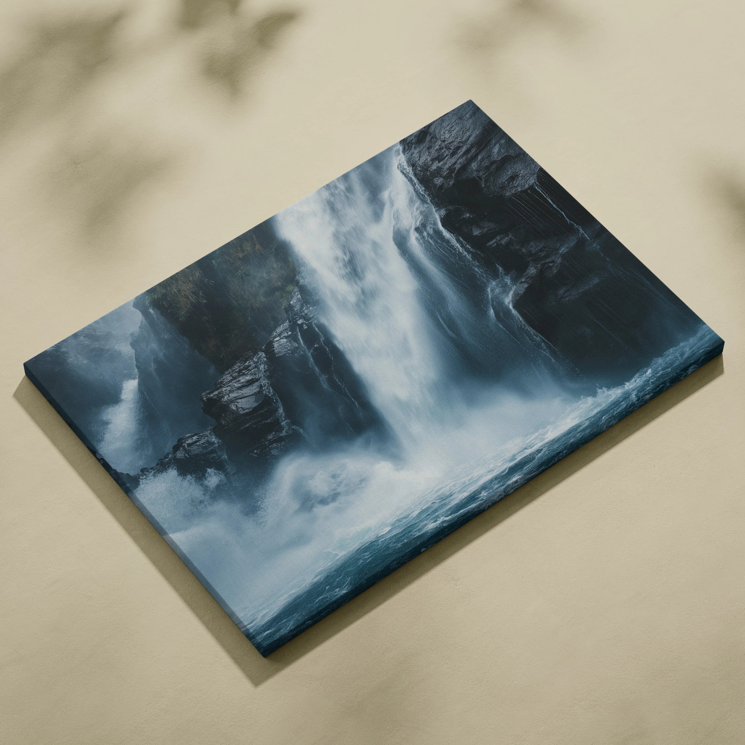 Canvas wall art featuring a misty rocky waterfall with cascading blue and white water.