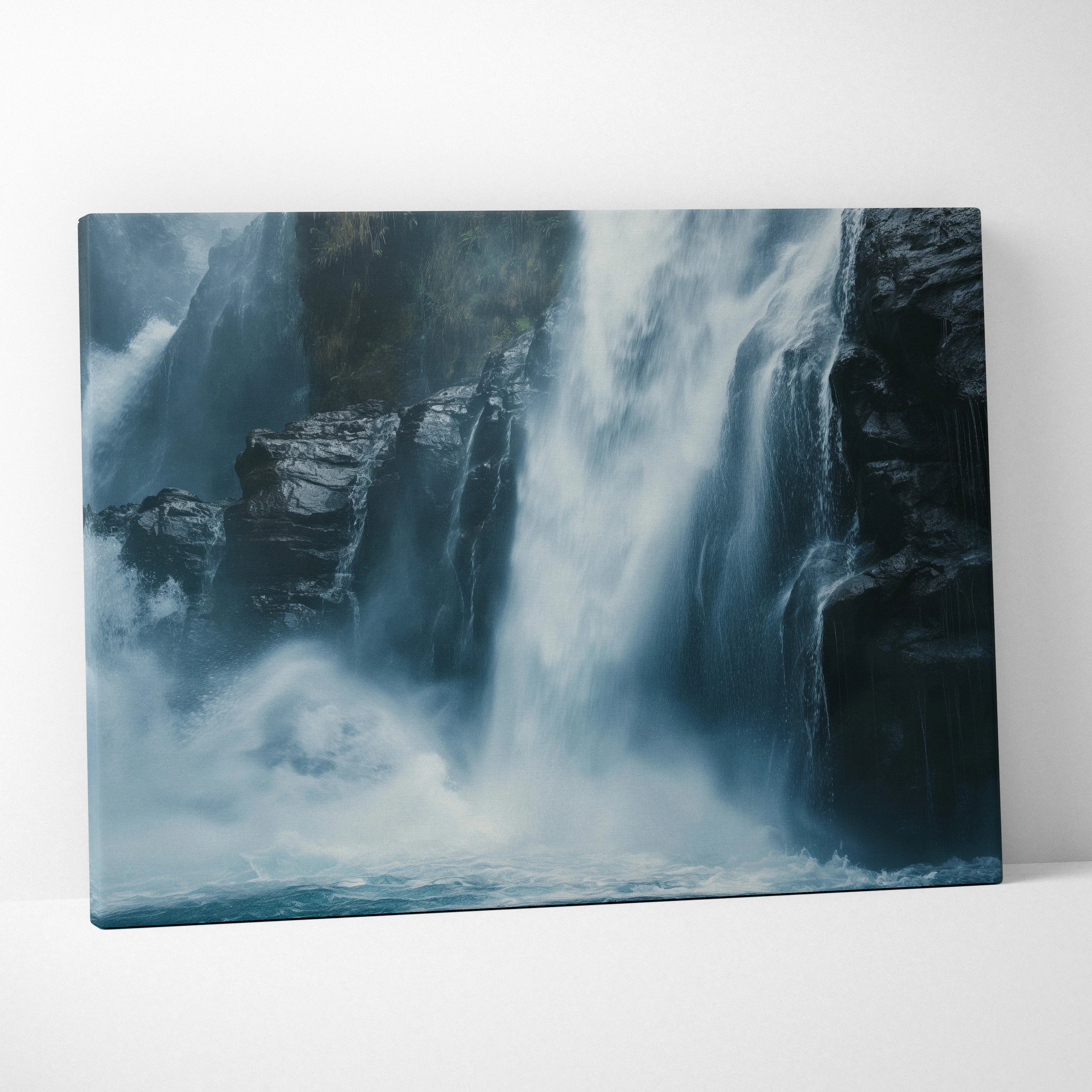Canvas wall art depicting a misty rocky waterfall in cool blue and gray tones for nature-inspired decor.
